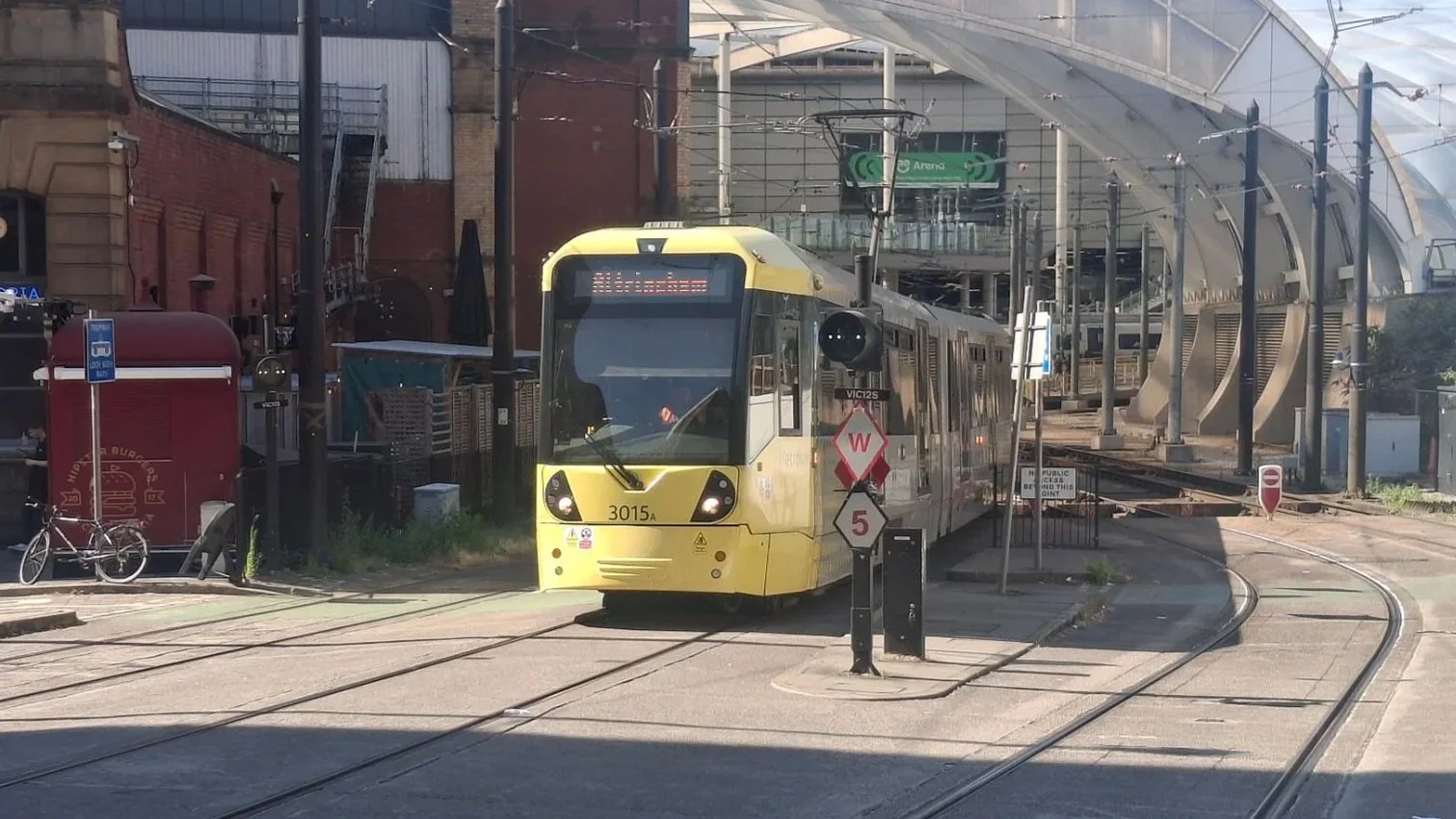 Tram to Altrincham rolls out of Victoria Metrolink stop in Manchester, 8 July 2026.