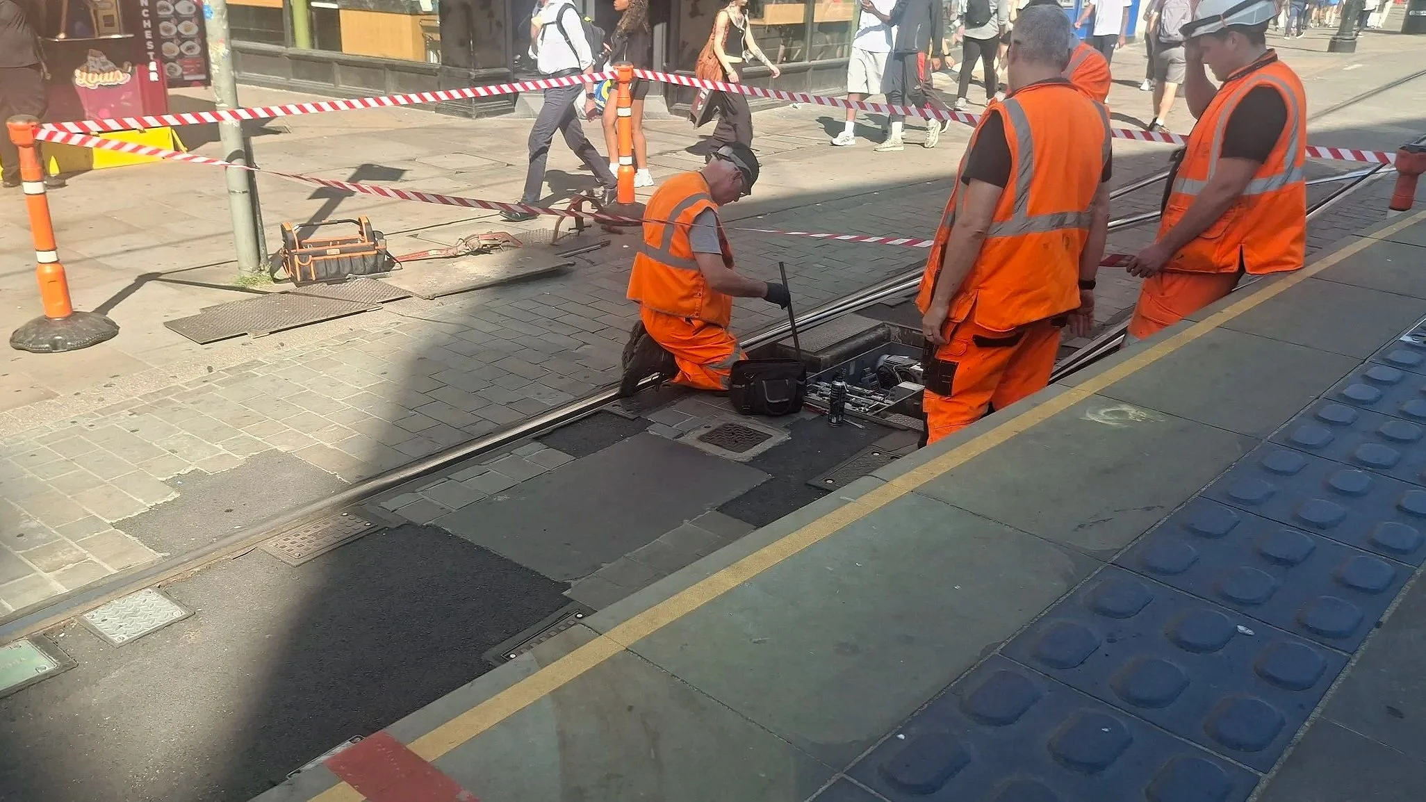 Workers on the tracks at Market Street Metrolink, 8 July 2026.