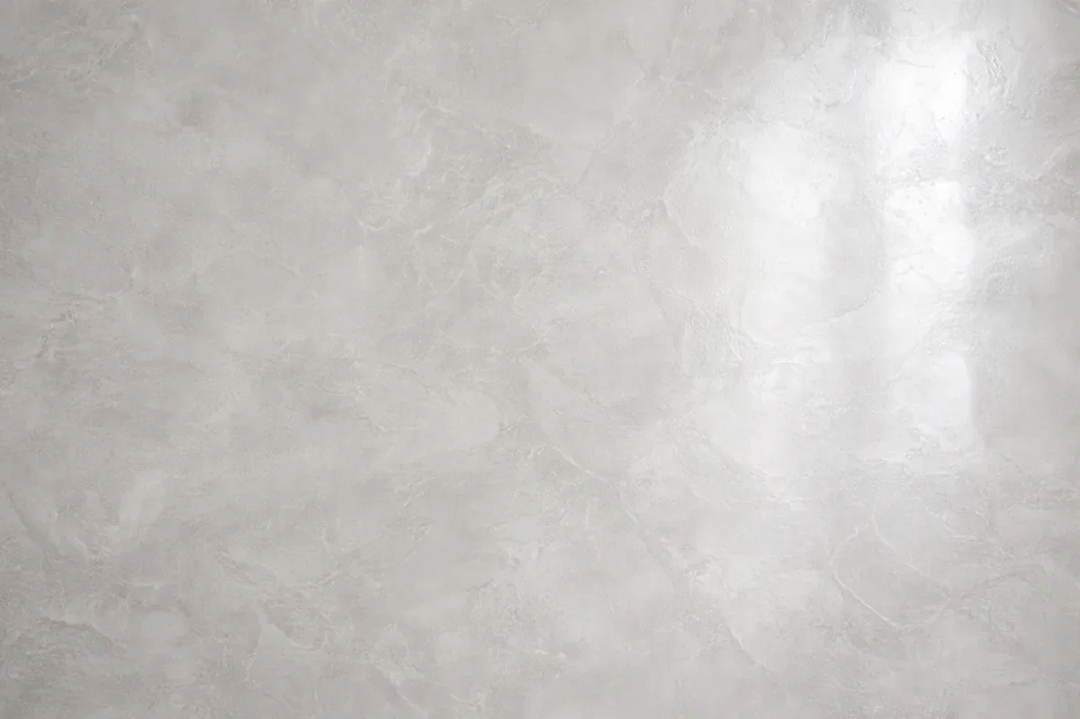 Polished Venetian plaster wall finish with smooth, high-gloss texture in Calgary