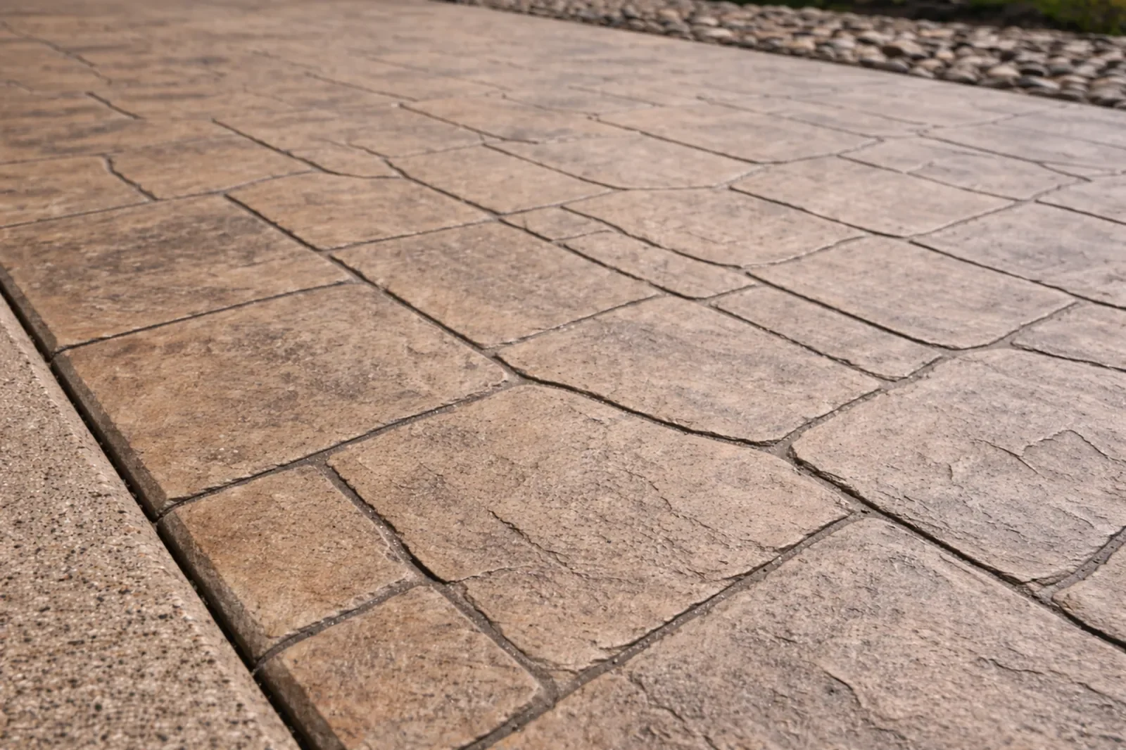 Stamped concrete patio with natural stone pattern and textured finish