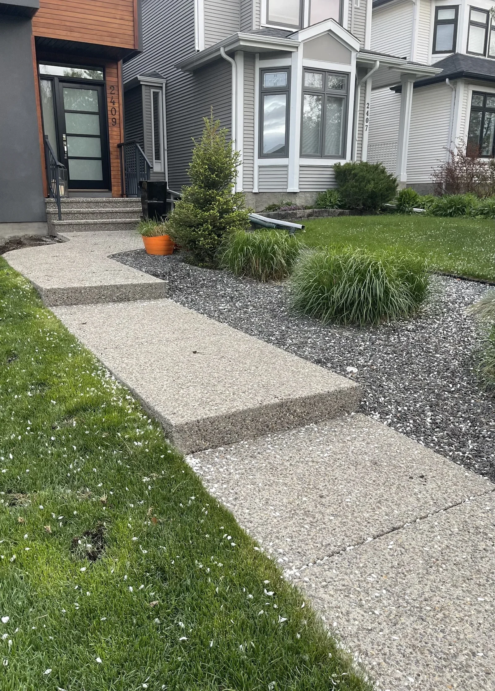 Concrete front walkway and landscaping project in Calgary.