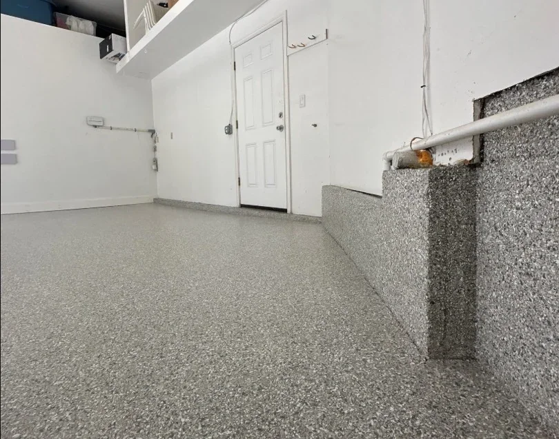 Garage epoxy floor renovation featuring a seamless, non-slip flake finish designed for durability, moisture resistance, and easy maintenance.