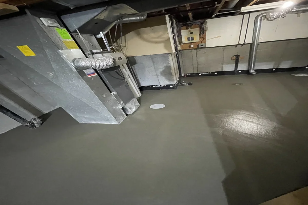 Freshly poured basement concrete slab in a Calgary home, finished smooth and level for long-term durability