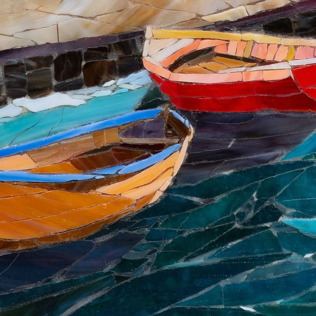 Close-up of an abstract mosaic artwork depicting three colorful boats on water, with pieces of stone in various shades of blue, red, orange, brown, black, and beige.