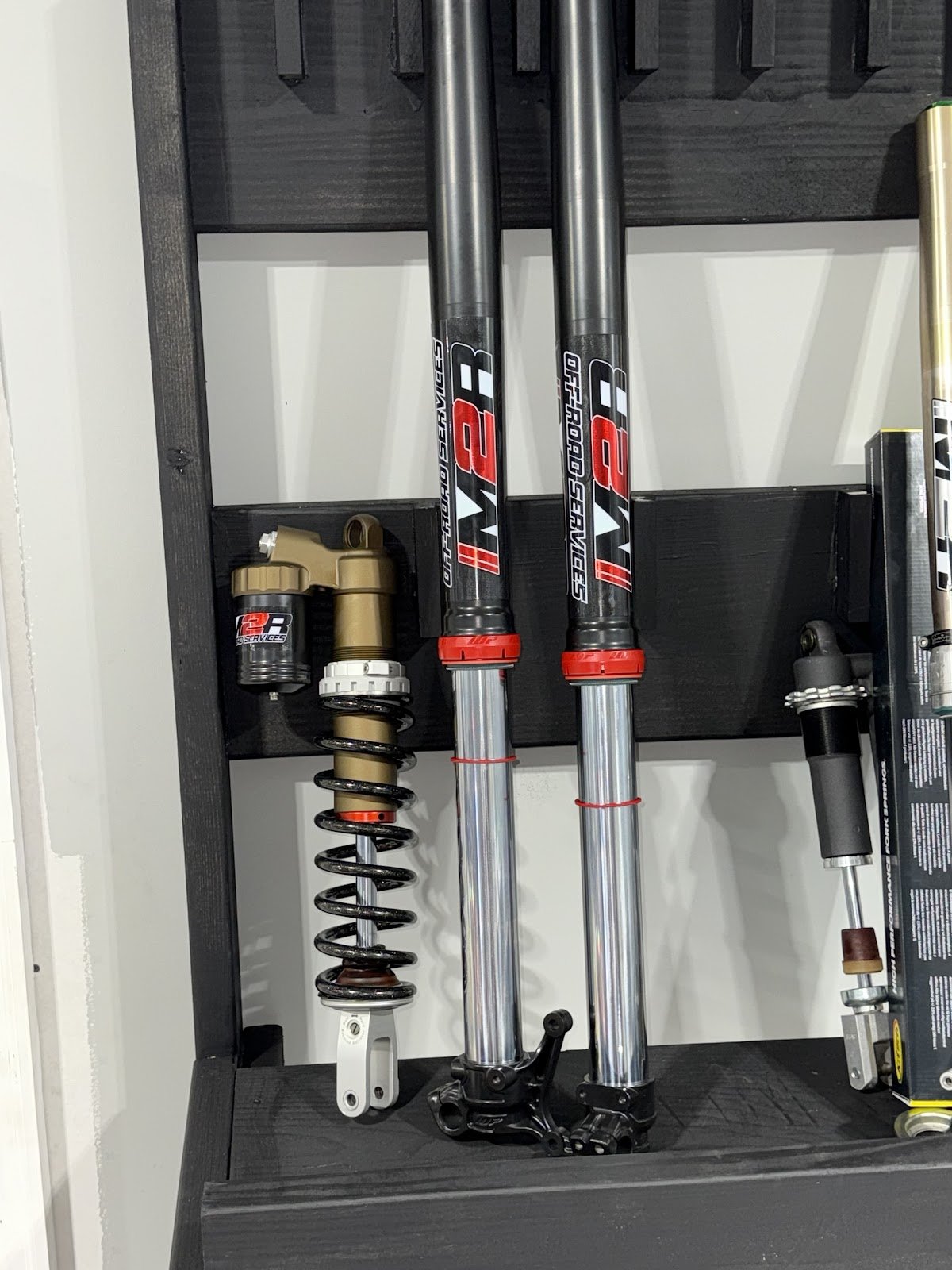 Freshly serviced suspension sitting pretty in the M2R Offroad shop.