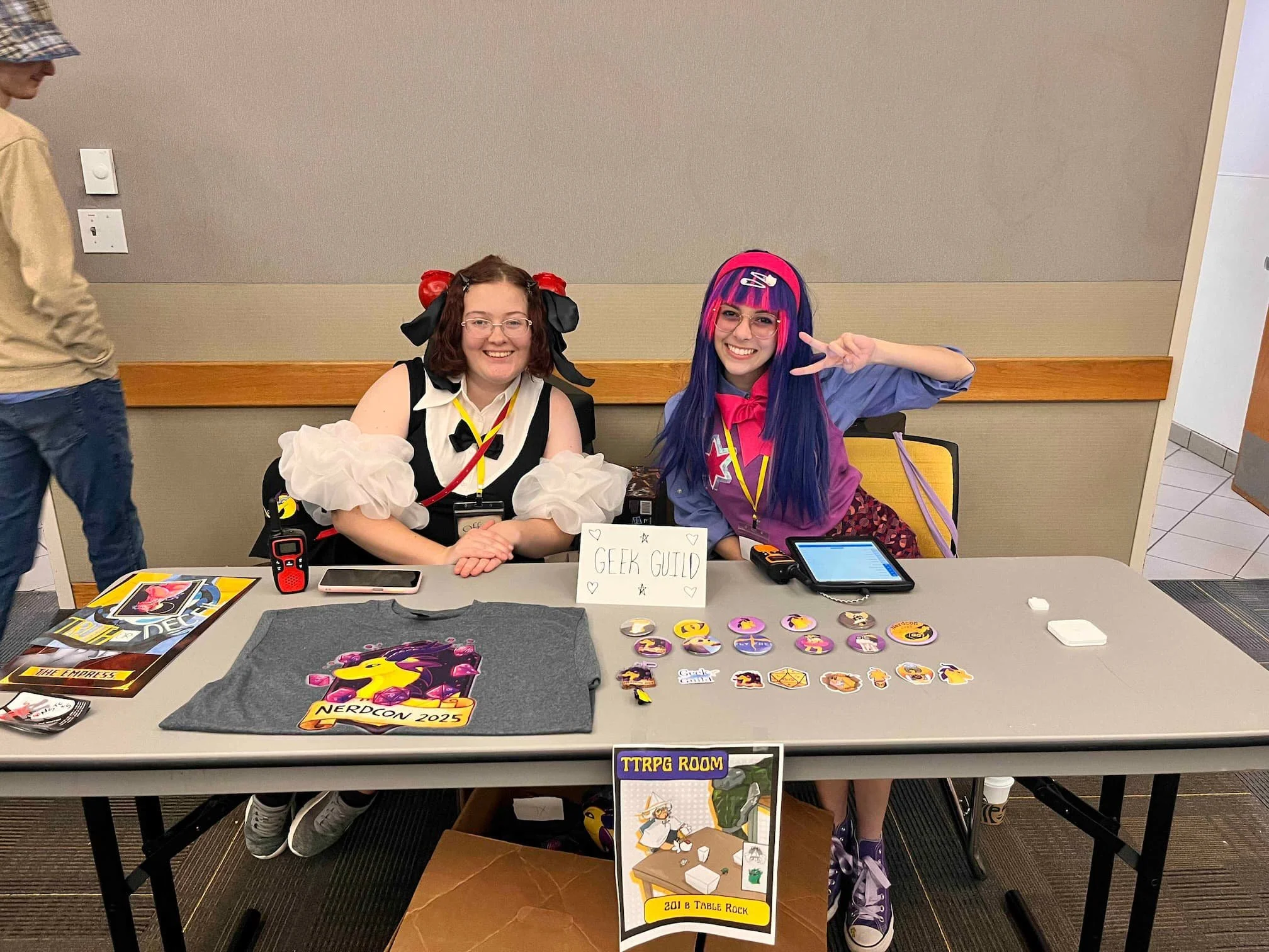 Geek Guild Officers in cosplay smiling at the camera