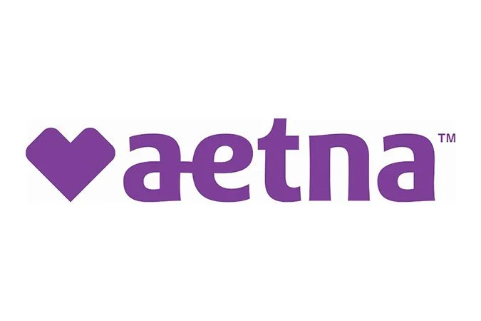 Aetna logo featuring a purple heart symbol followed by the text 'aetna' in purple.