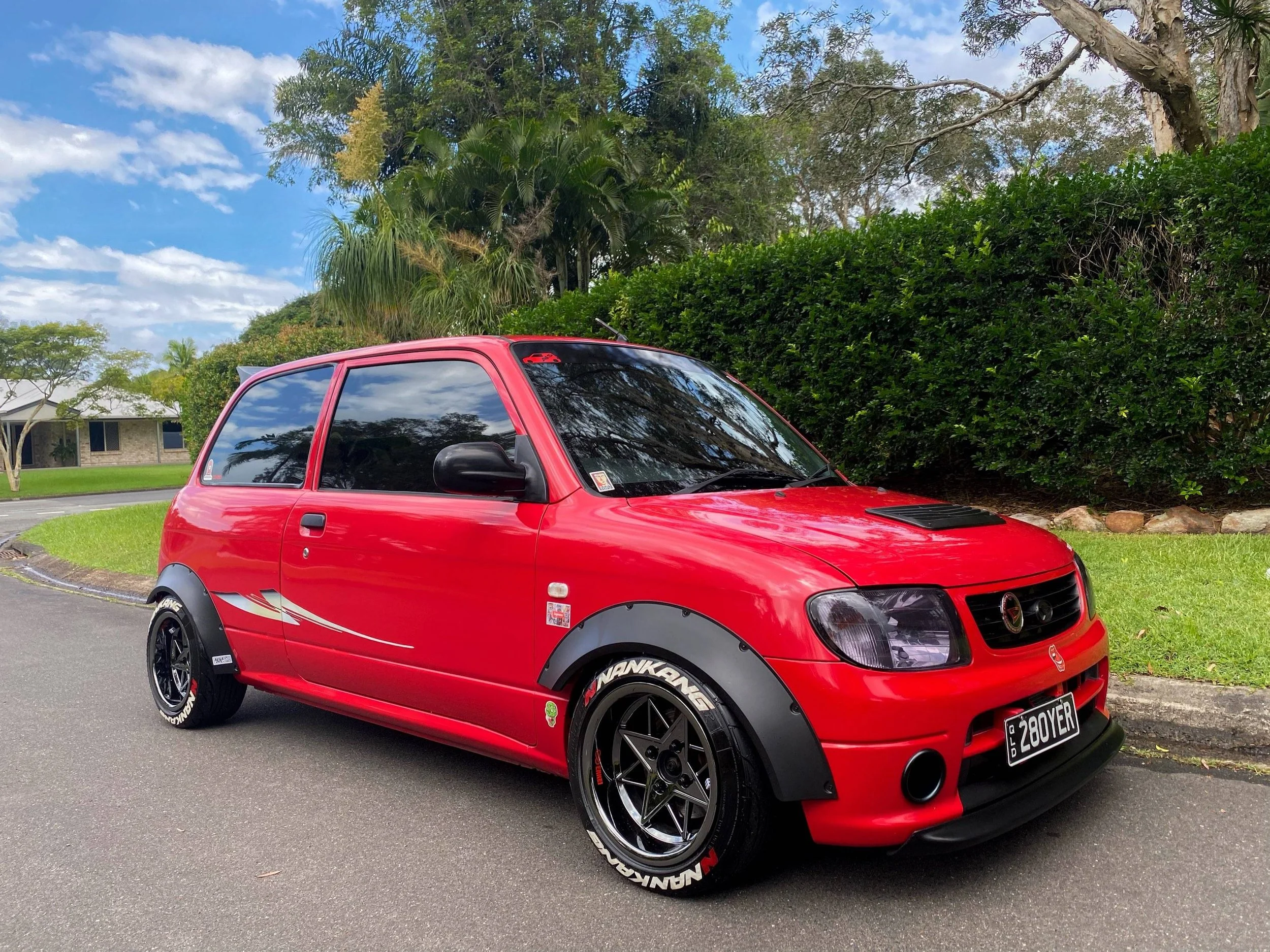 Red Modified Daihatsu Mira L700 with custom ASTRO OS Formula 15" x 7.5" wheels