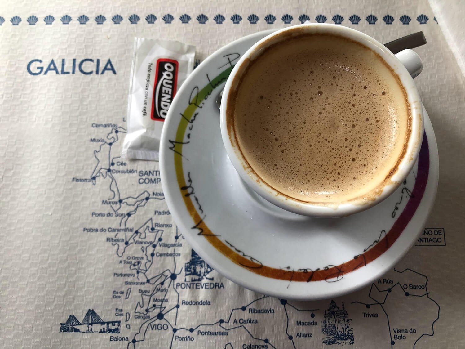 cup of cafe latte on Galicia placemat