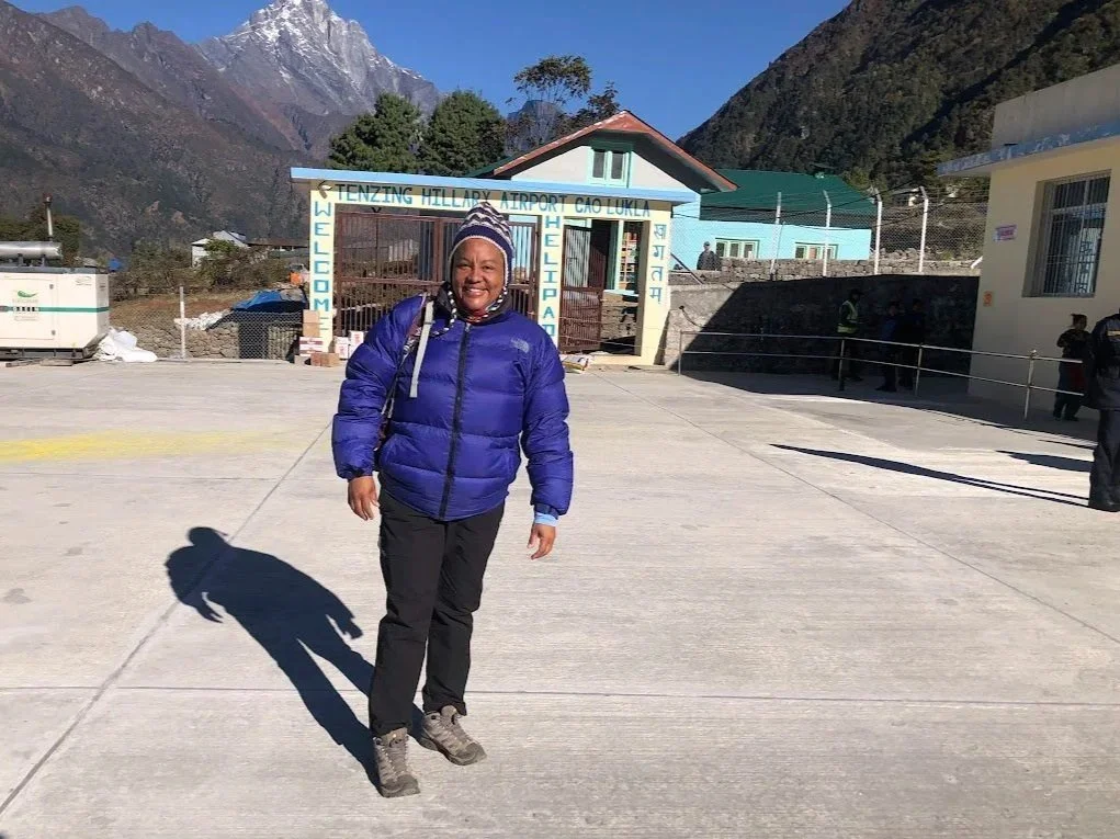 woman hiker in front of airport in luckla nepal