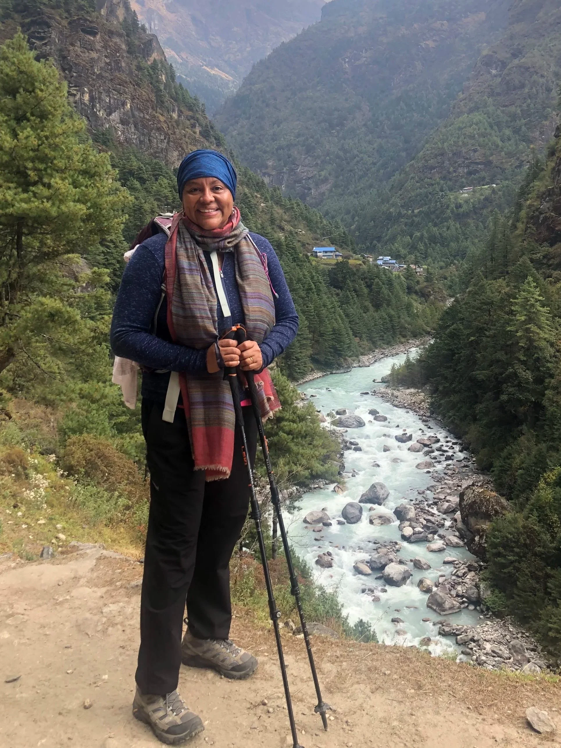 woman-hiking-poles-in-mountains-river