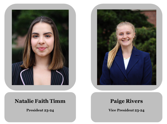 Side-by-side portraits of two young women in business attire. The left woman has shoulder-length brown hair, a black blazer with pink pinstripes, and a slight smile. The right woman has long blonde hair, a blue blazer, and is smiling. Each portrait has a label beneath with their names, titles, and age range.