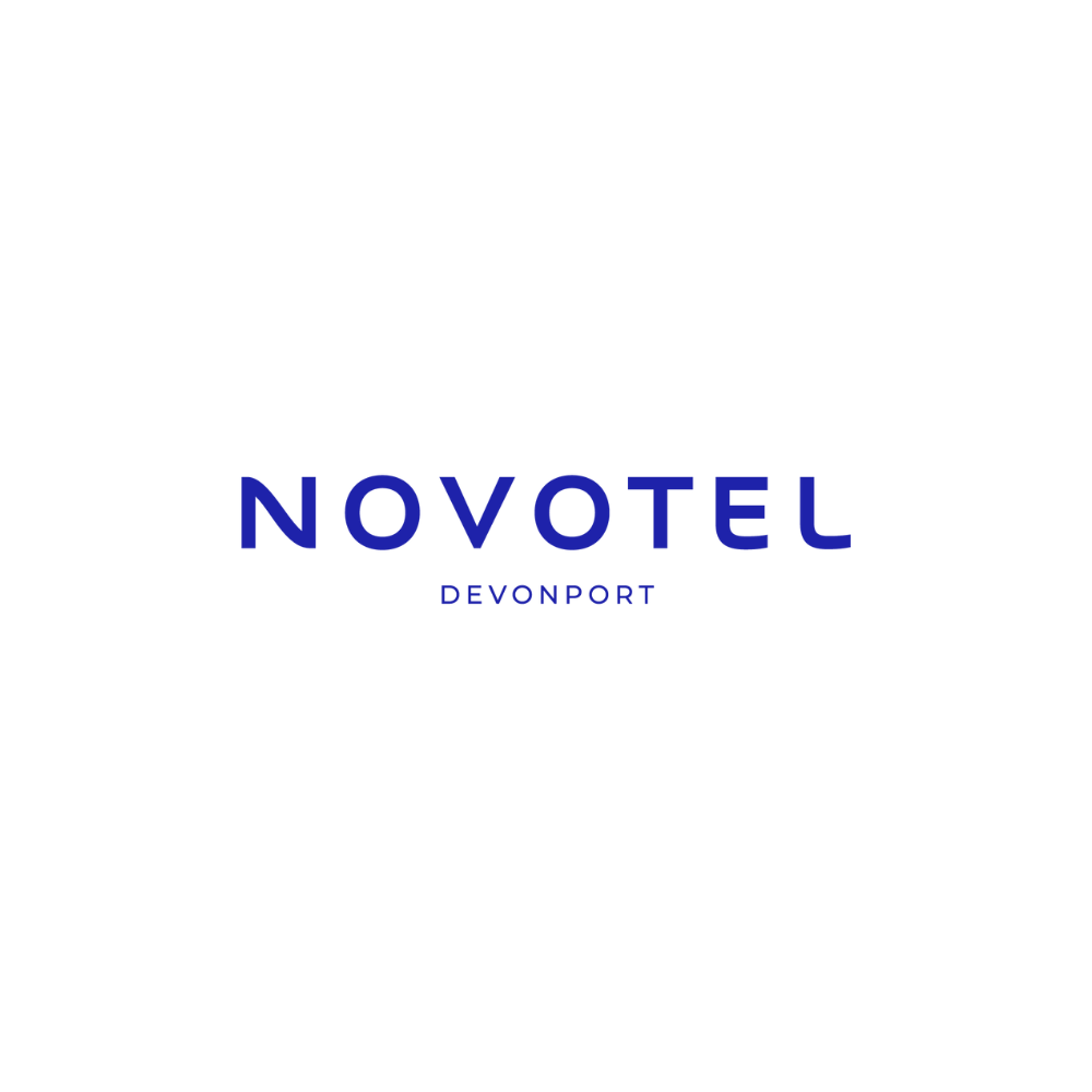 Logo of Novotel Devonport hotel with a black circular background and the blue text 'NOVOTEL' and 'DEVONPORT' in the center.