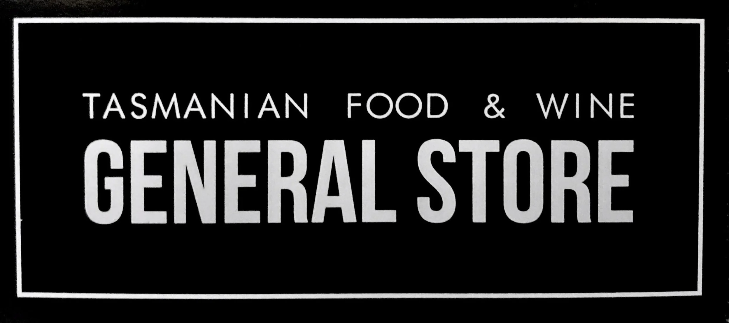 Sign for Tasmanian food, wine, and general store.