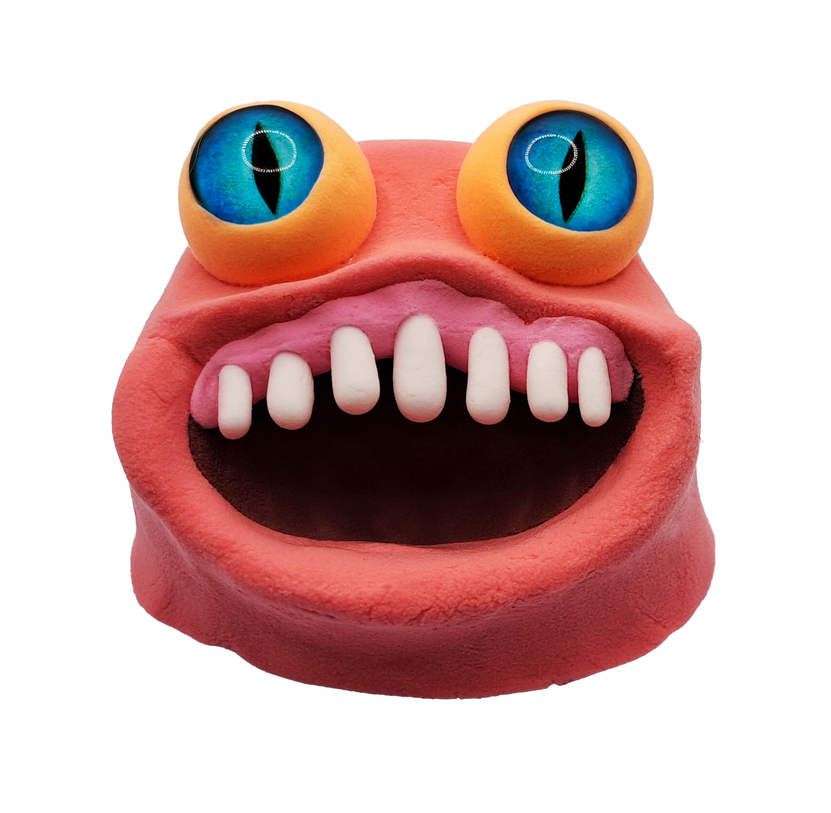 Colorful monster with big blue eyes, pink lips, and white teeth in a gaping mouth.