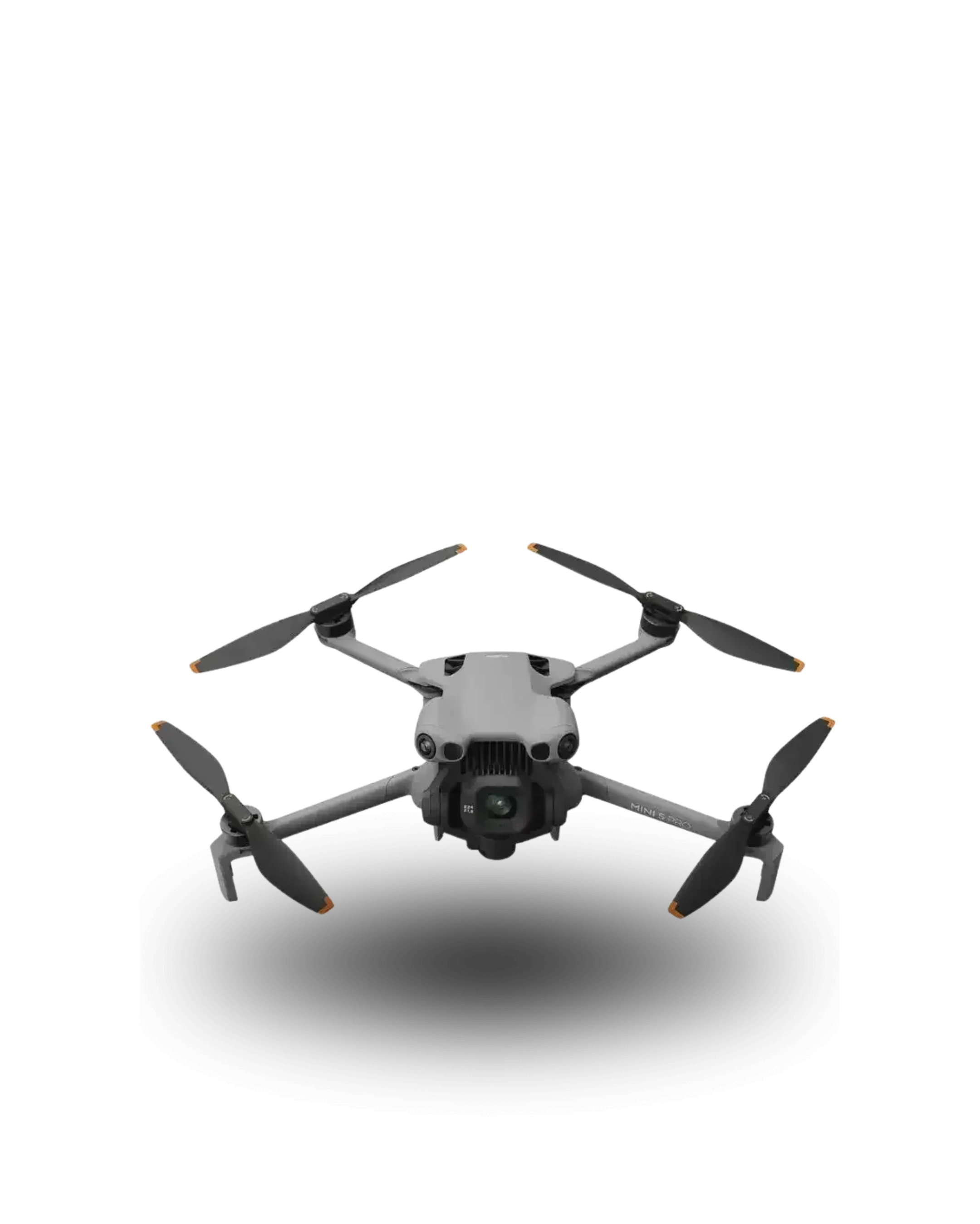A gray drone with four propellers, a camera mounted underneath, and black landing gear, casting a shadow on a white background.