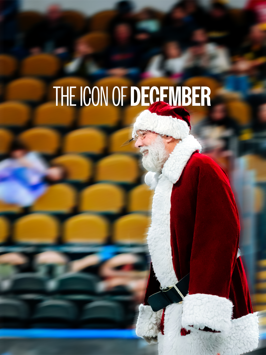 A man dressed as Santa Claus walking in a stadium with blurred spectators in the background.