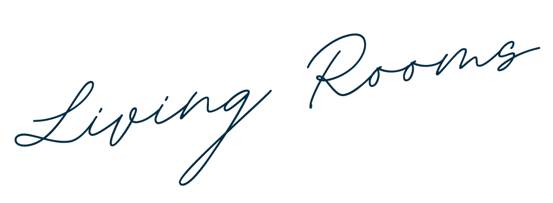 Decorative sign with the words 'Living Rooms' in cursive script.