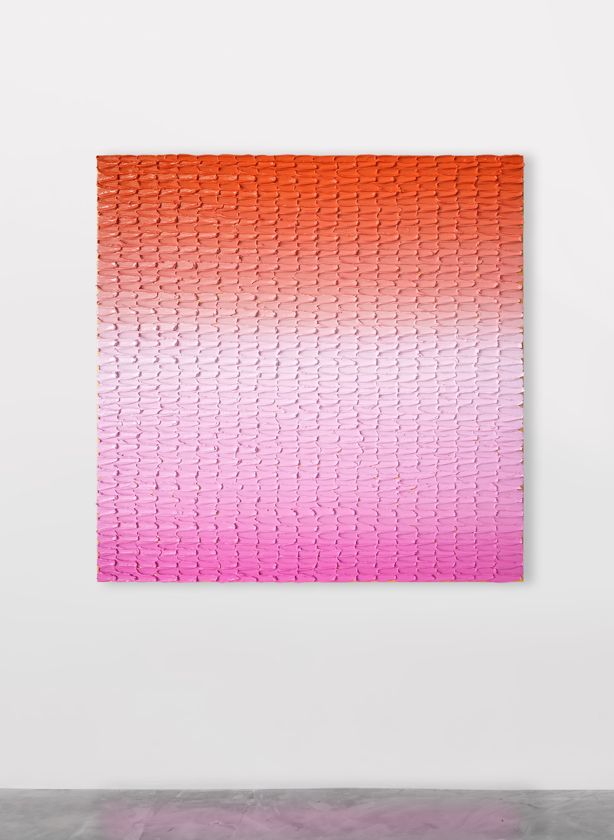 A textured square gradient painting hanging on a gallery wall with orange at the top of the canvas fading to pink at the bottom.