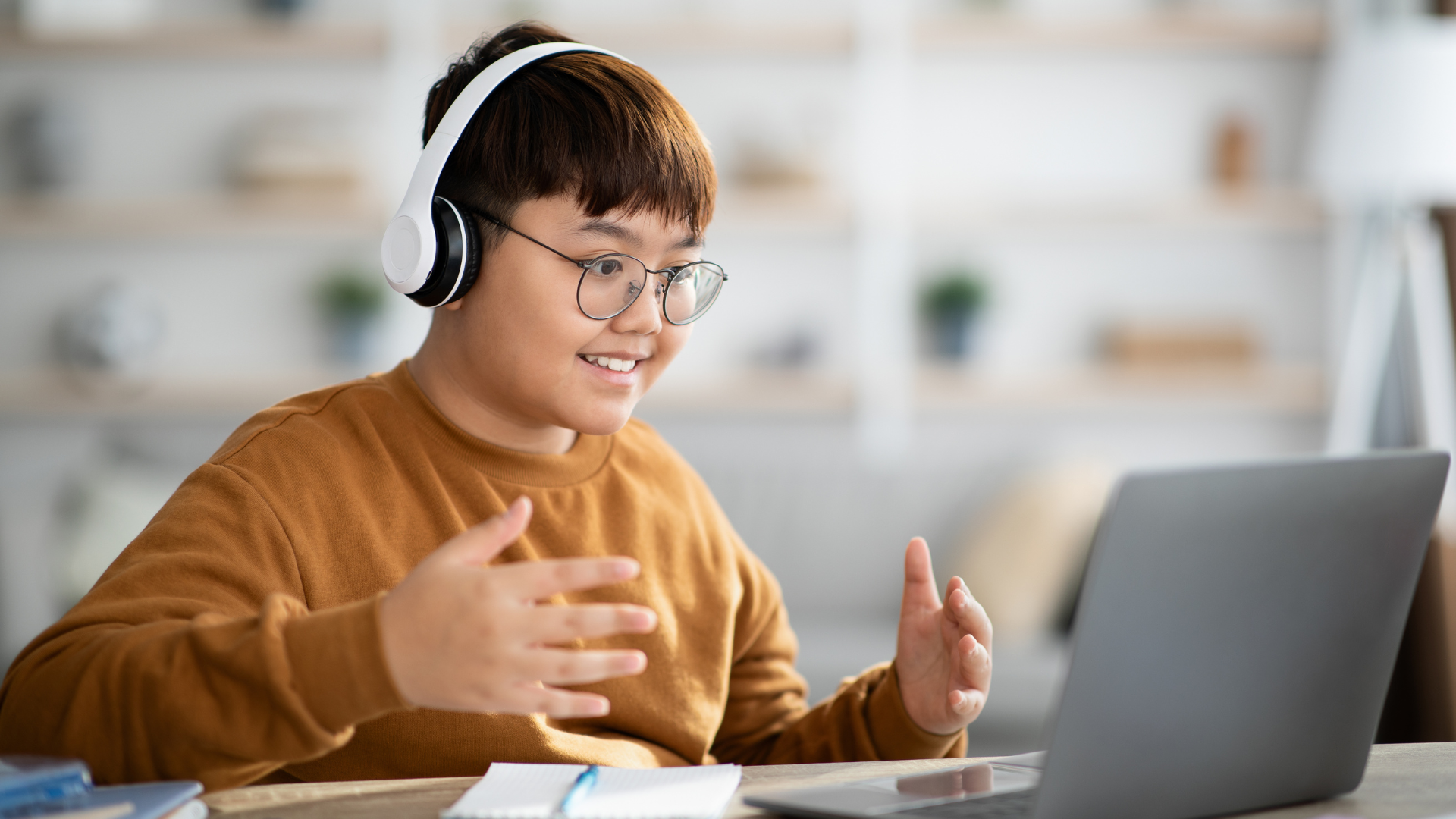 Student learning to code using python programming software
