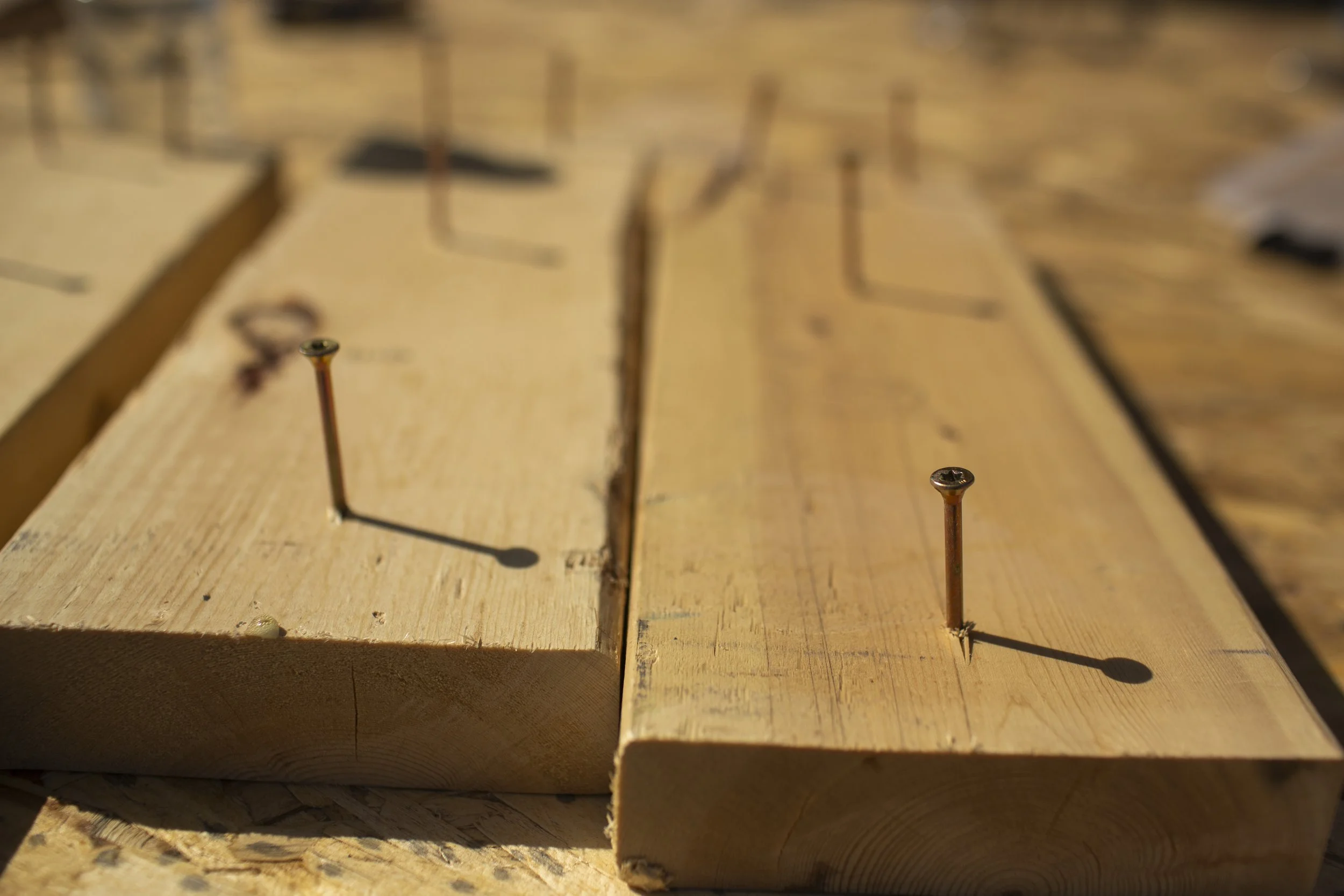 Wooden boards with nails sticking out