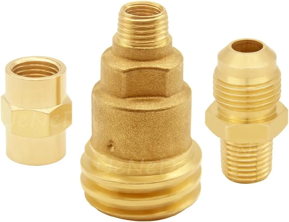 Three brass plumbing fittings, including a larger central fitting with external threads, flared base and textured surface, flanked by two smaller fittings with internal and external threads.