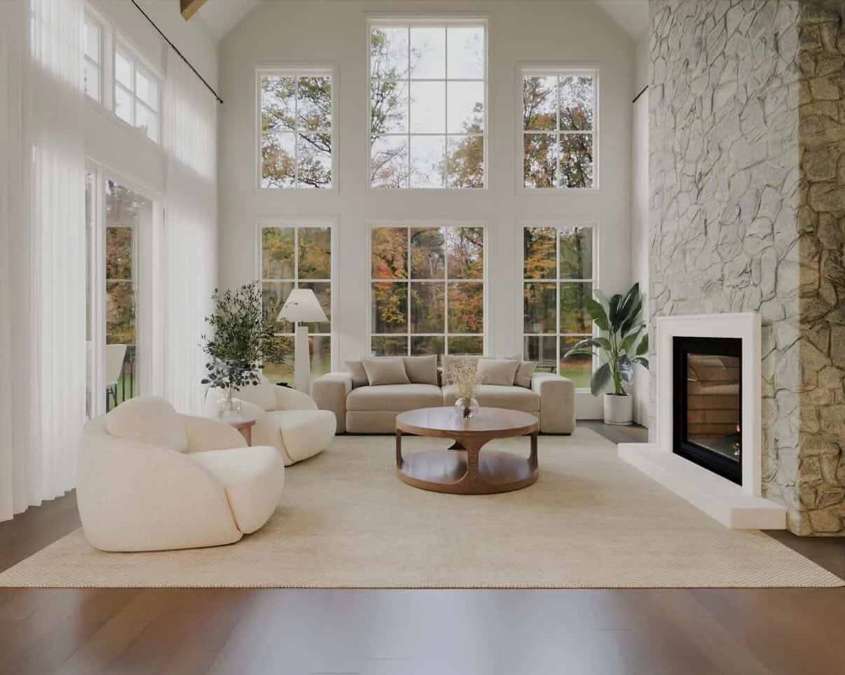 Salon moderne avec grande cheminée en pierre, canapé beige, fauteuils blancs, tapis beige, table basse ronde en bois, grande fenêtre laissant entrer la lumière naturelle, décorations végétales.