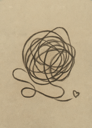 A line drawing of a scribbled ball with a small heart below it.
