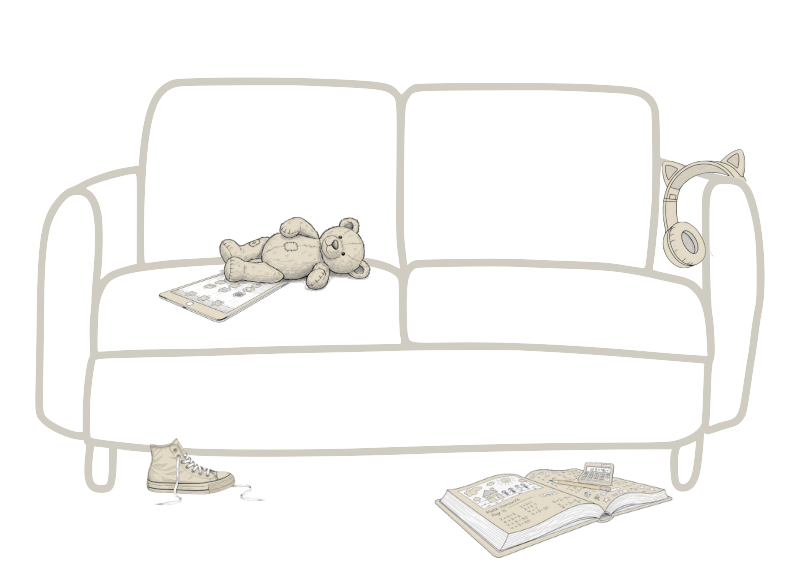 A teddy bear lying on a bed with a phone nearby, a pair of sneakers on the floor, an open book, and a wall with a plug socket and a remote control.