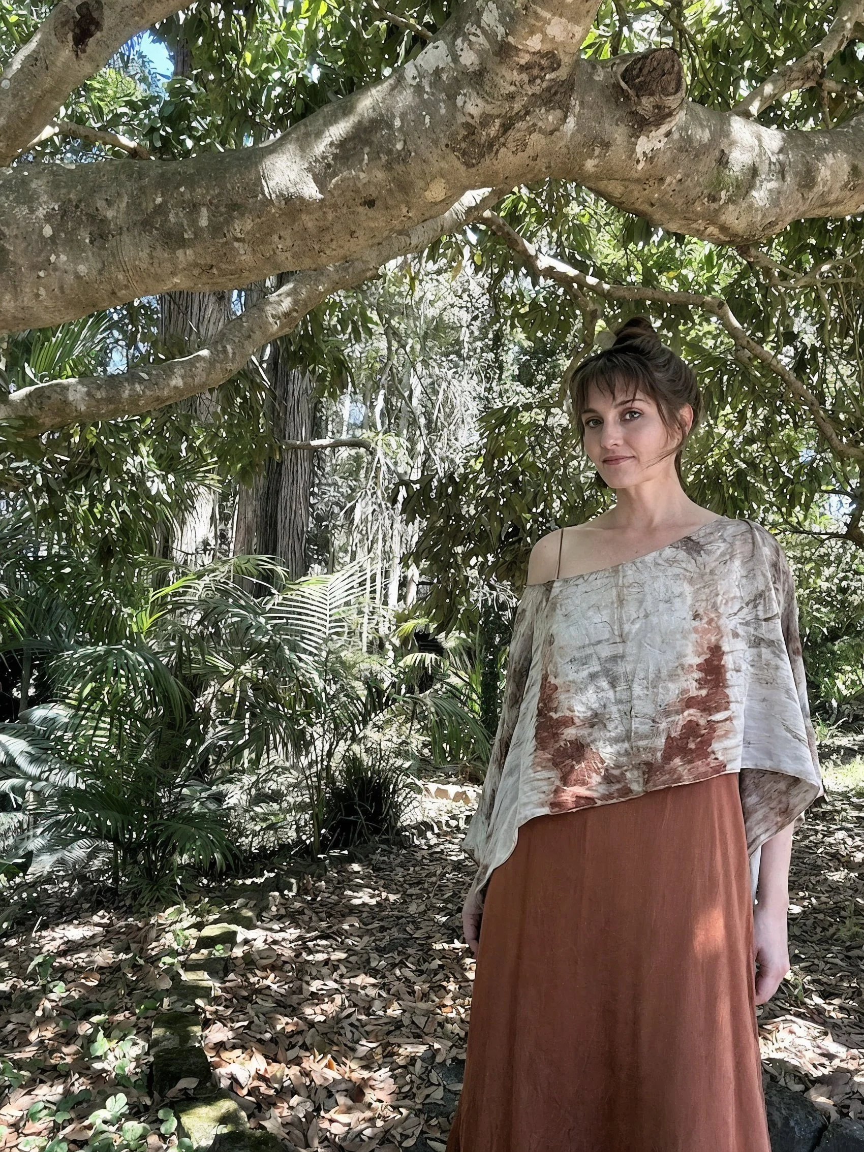 Photo of a woman named Alacoque standing in a natural style garden