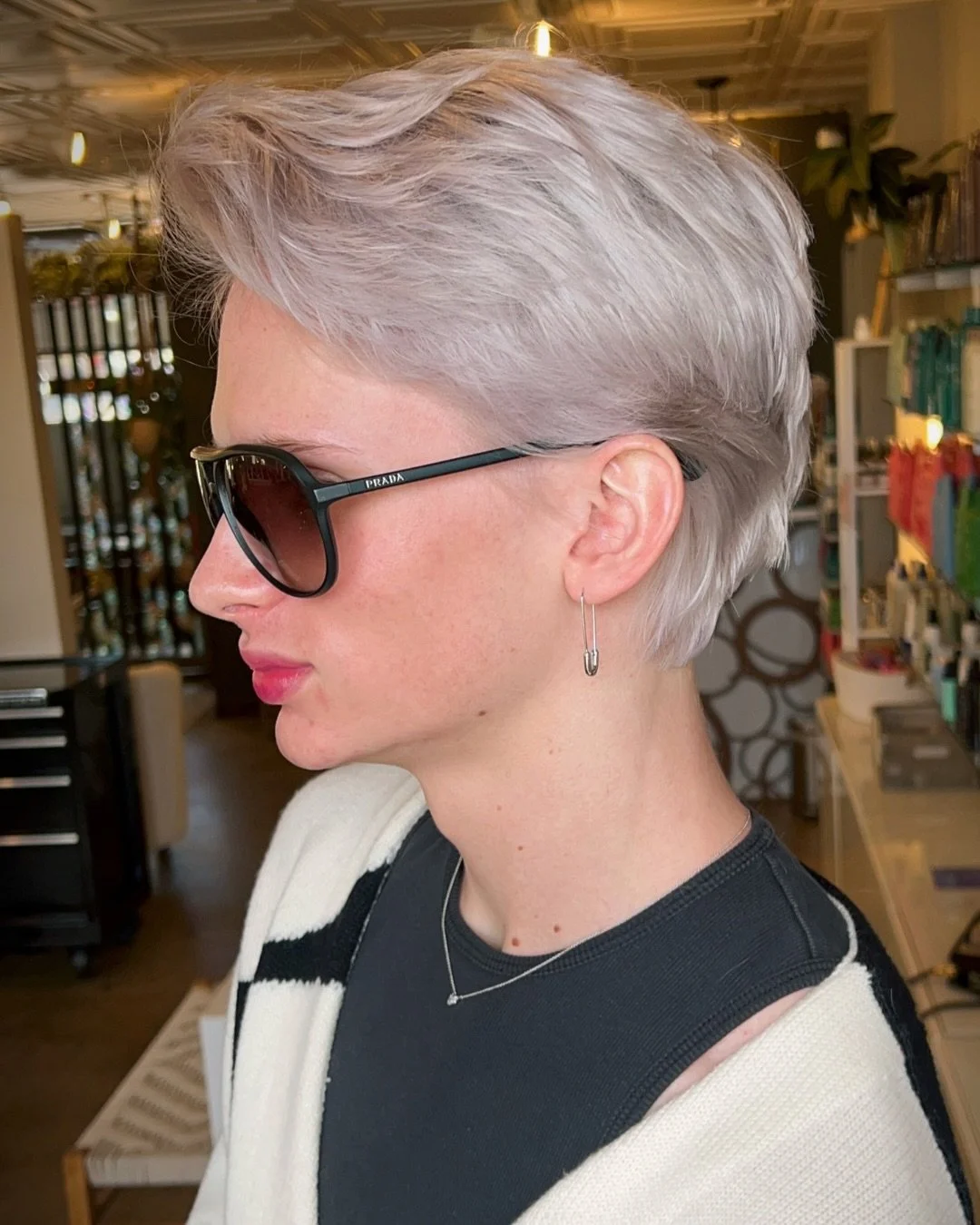 Megan absolutely nailed this textured short cut and custom icy color! Short hair is having a major moment, and this effortlessly cool look proves exactly why. Ready to chop it all off or refresh your platinum? Tap the link in our bio to book your nex