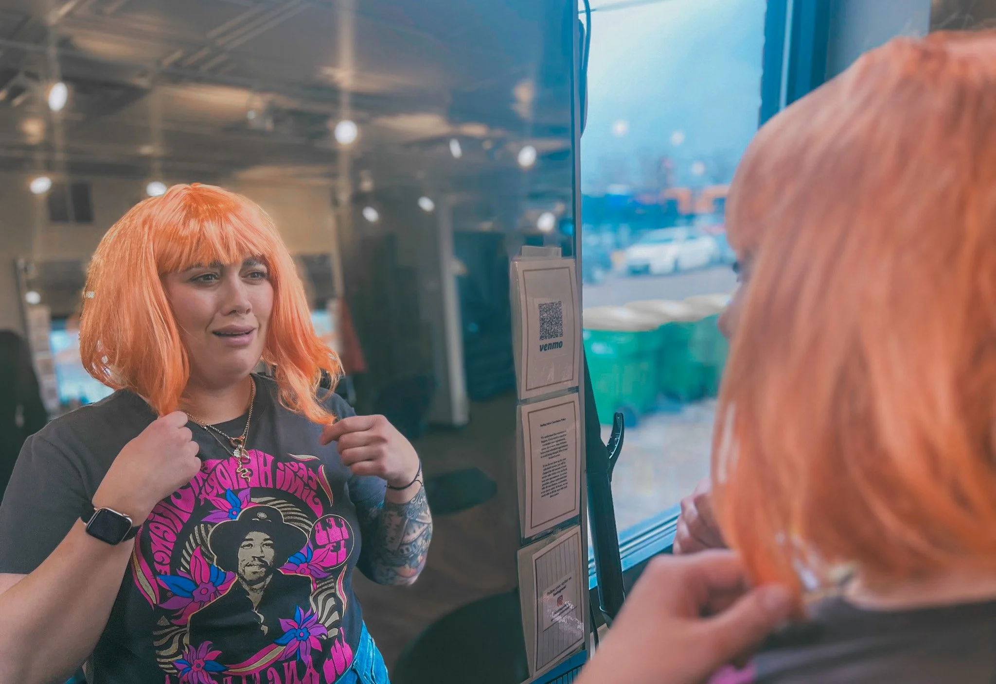 A salon guest cries in the mirror after their appointment left them with uneven copper hair.