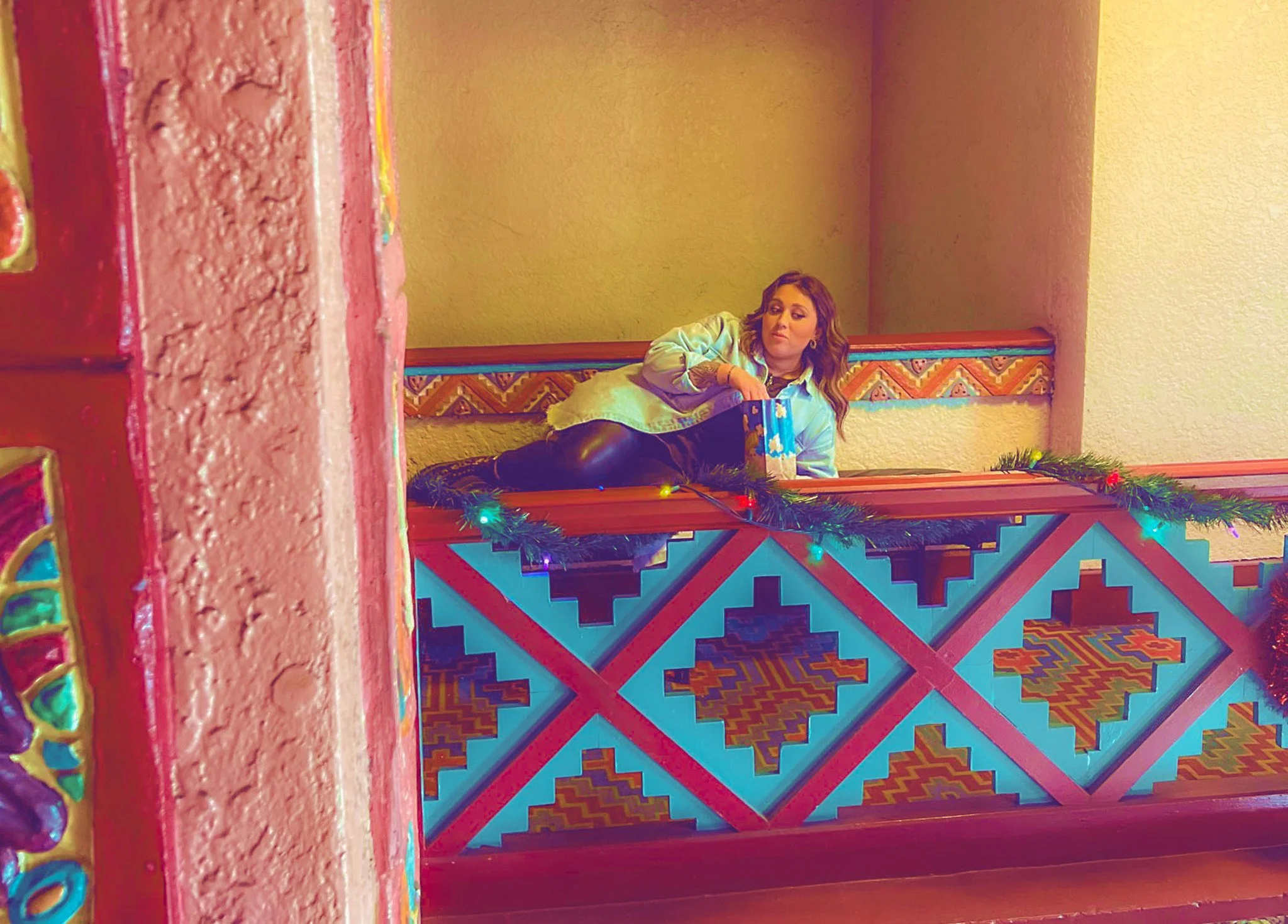 Megan Brockman eating popcorn in another corner of the Mayan Theater.