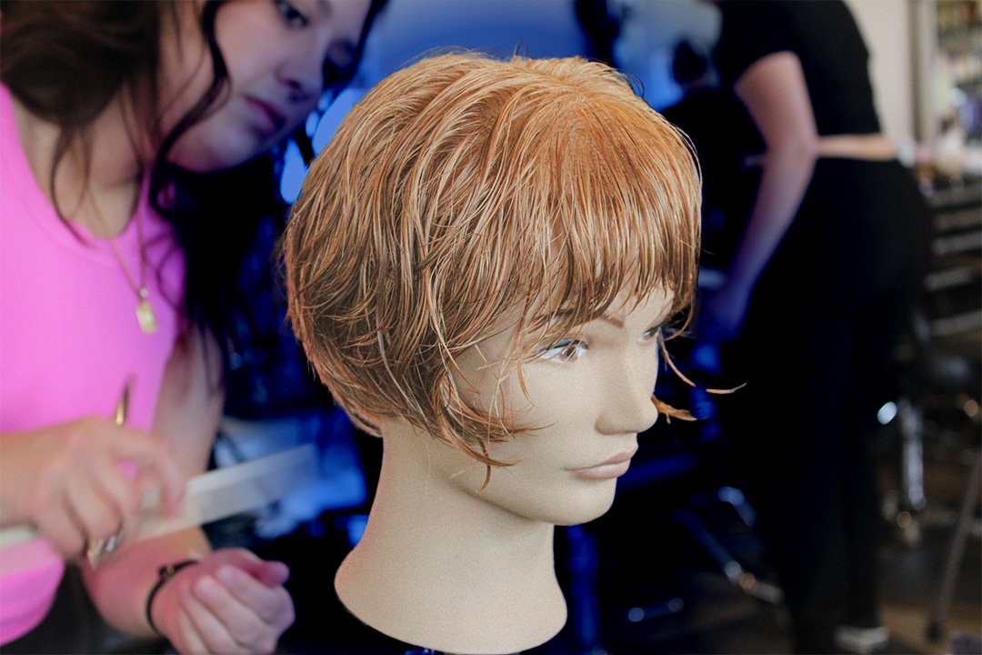 Megan Brockman finalizes her haircut.