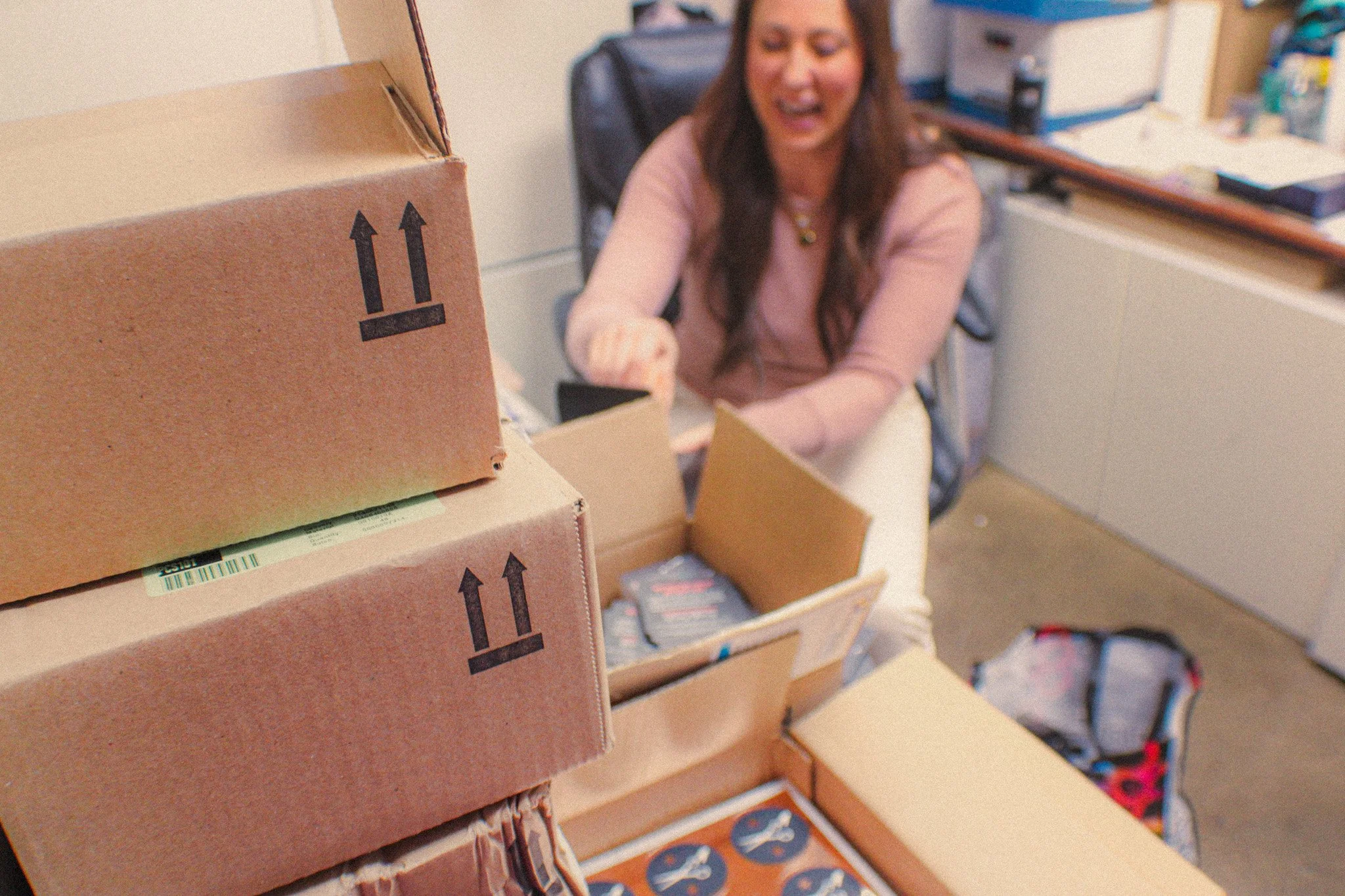 Sonia Nordmeyer prepares holiday boxes for guests in the office.