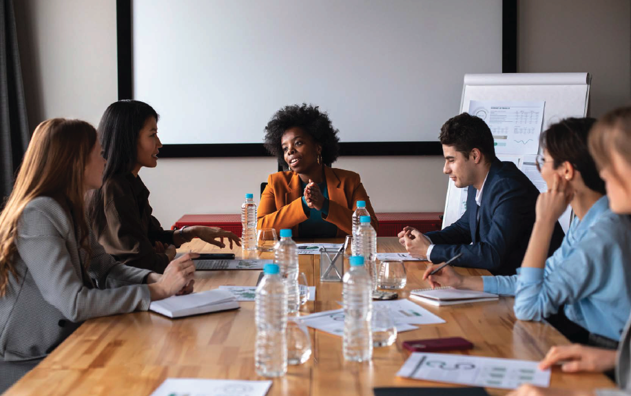 Business people sitting around a conference table discussing