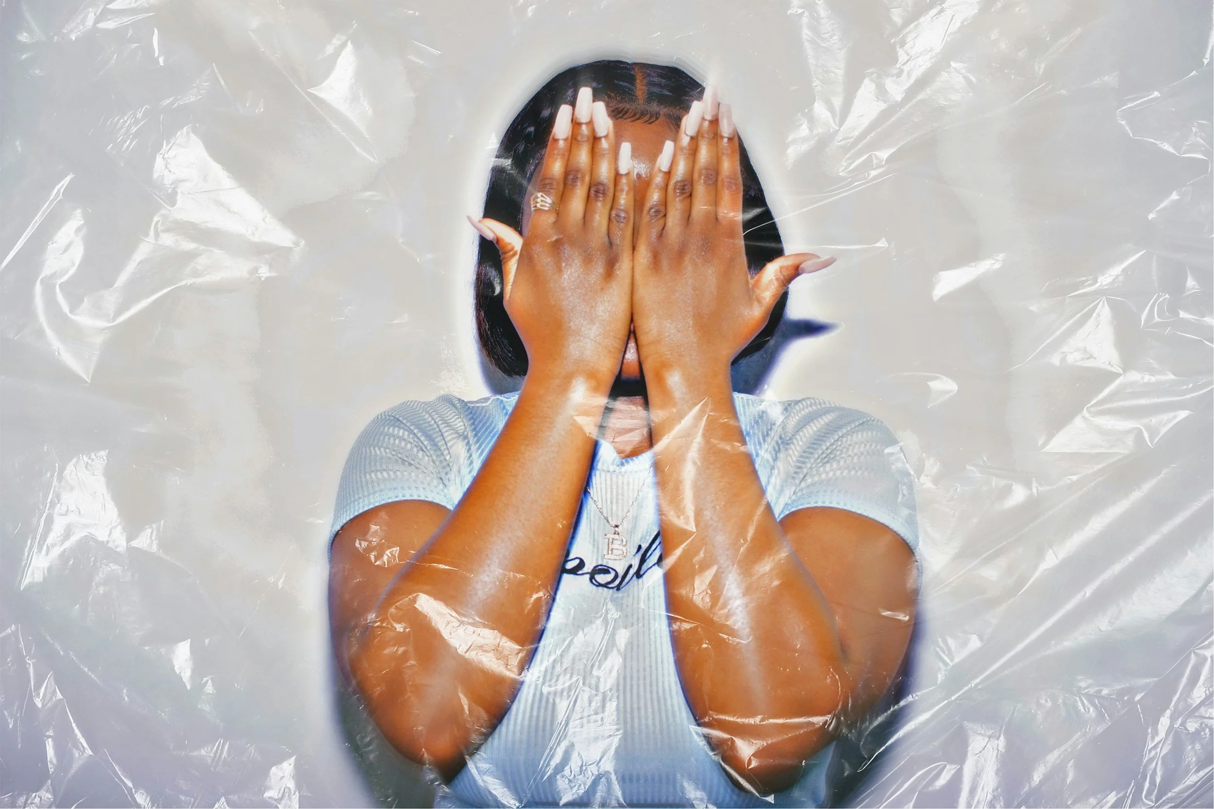 Person covering face in distress, symbolizing emotional exhaustion and the need for boundaries in toxic or narcissistic relationships