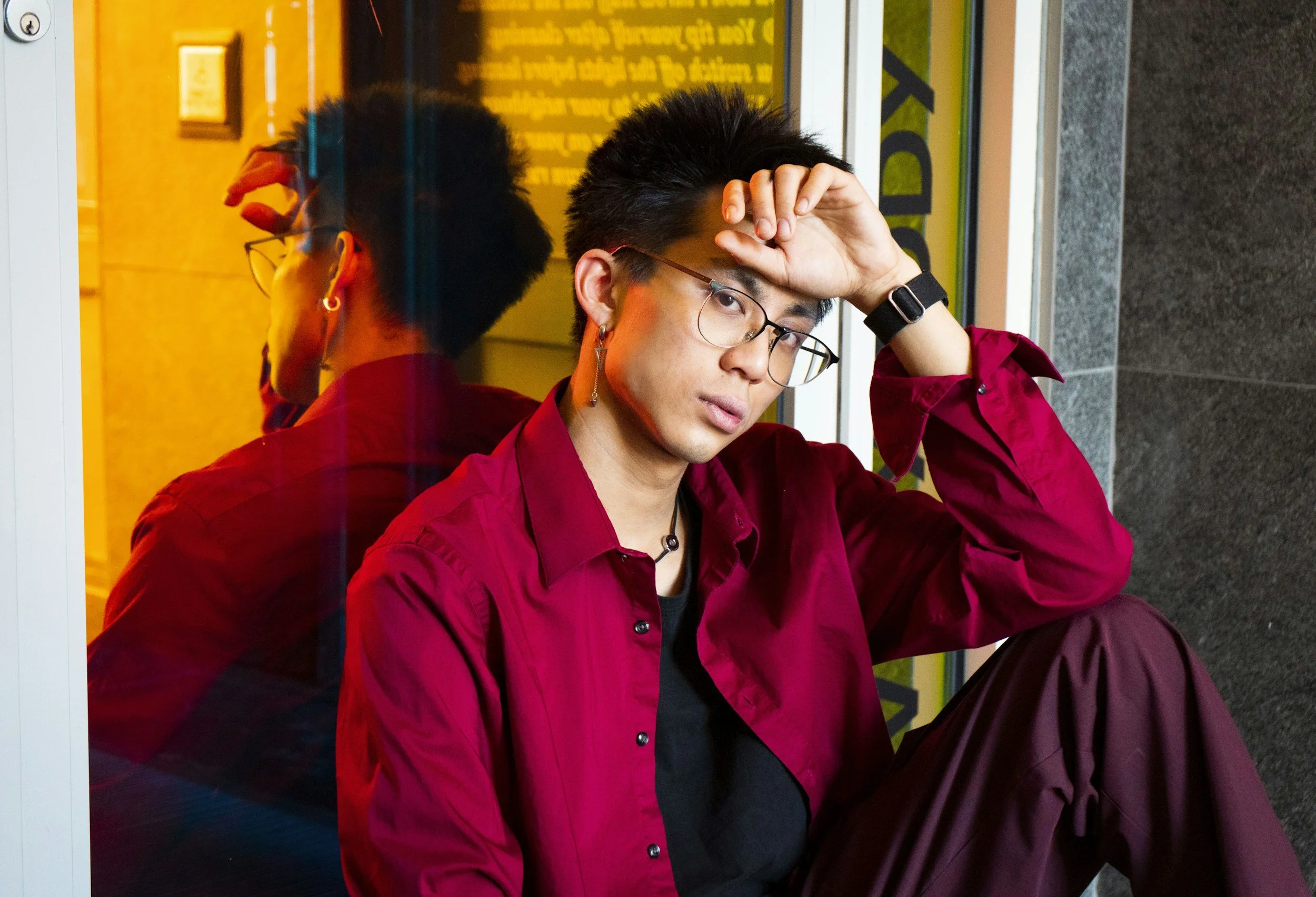 Man sitting near reflective surface representing antisocial personality disorder and emotional detachment