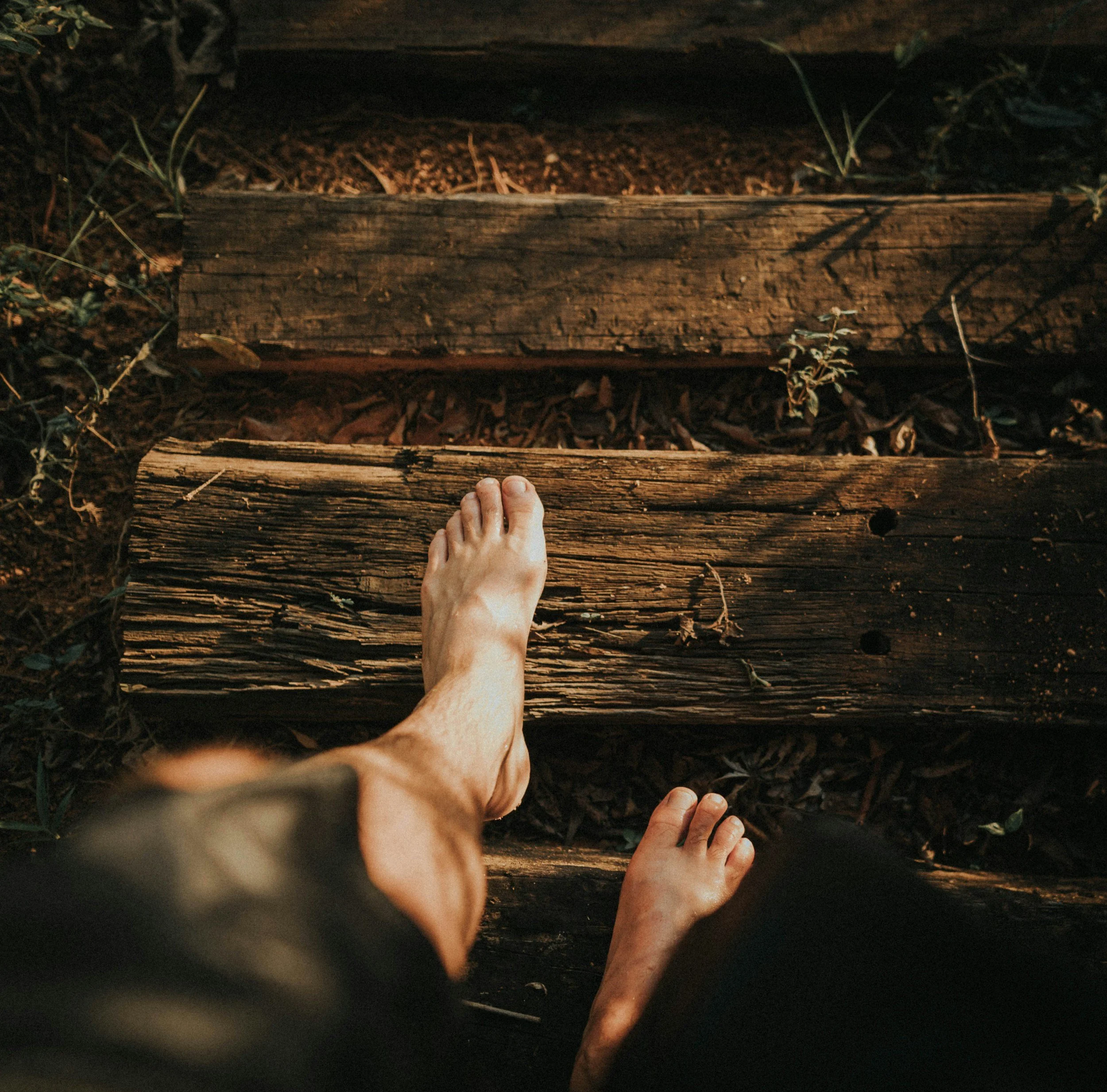 Person resting outdoors representing emotional recovery, self-reflection, mindfulness, and healing after emotional trauma.