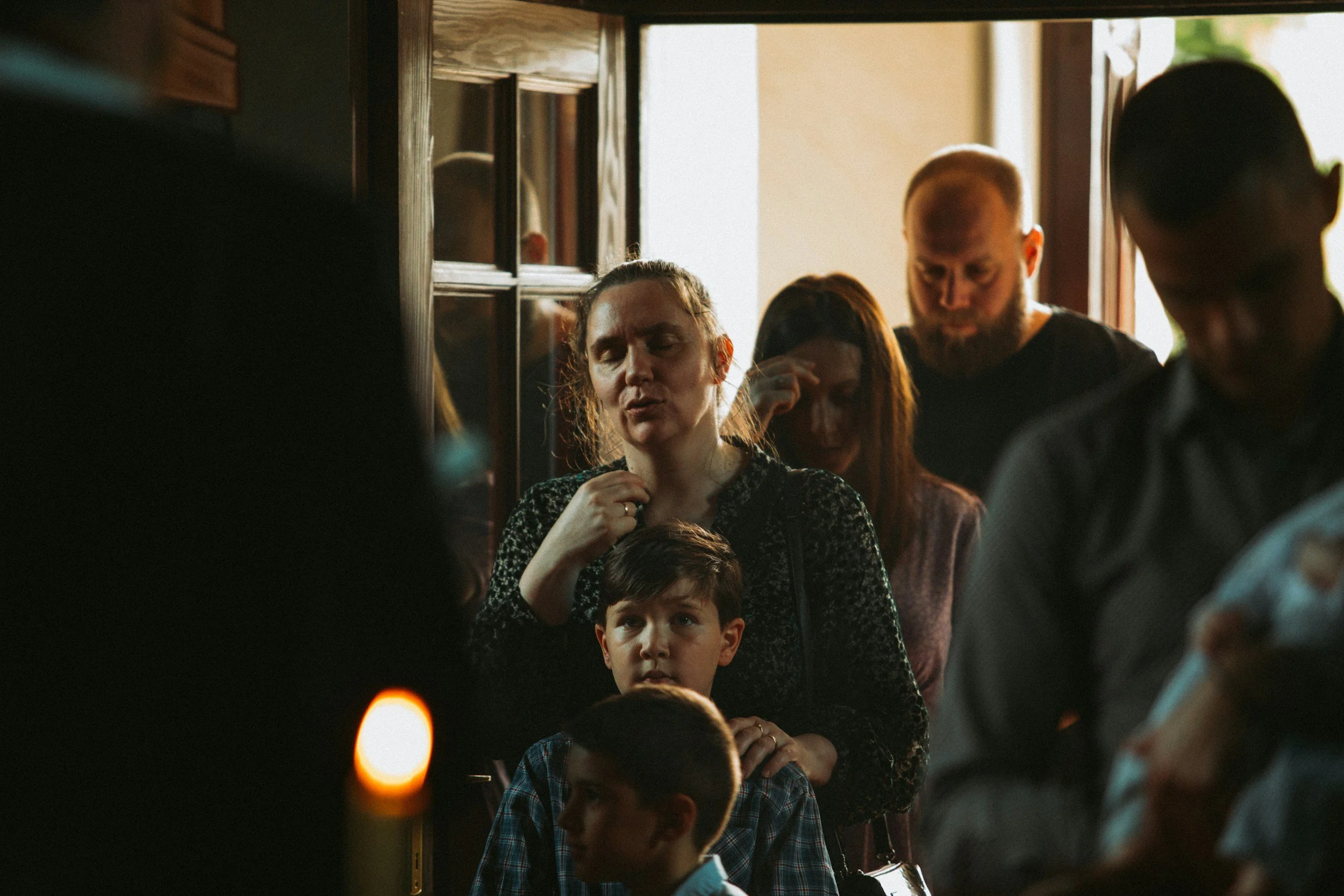 Family gathered together during an emotional moment, demonstrating how a mother's mental health can impact family relationships, emotional connection, and household well-being.