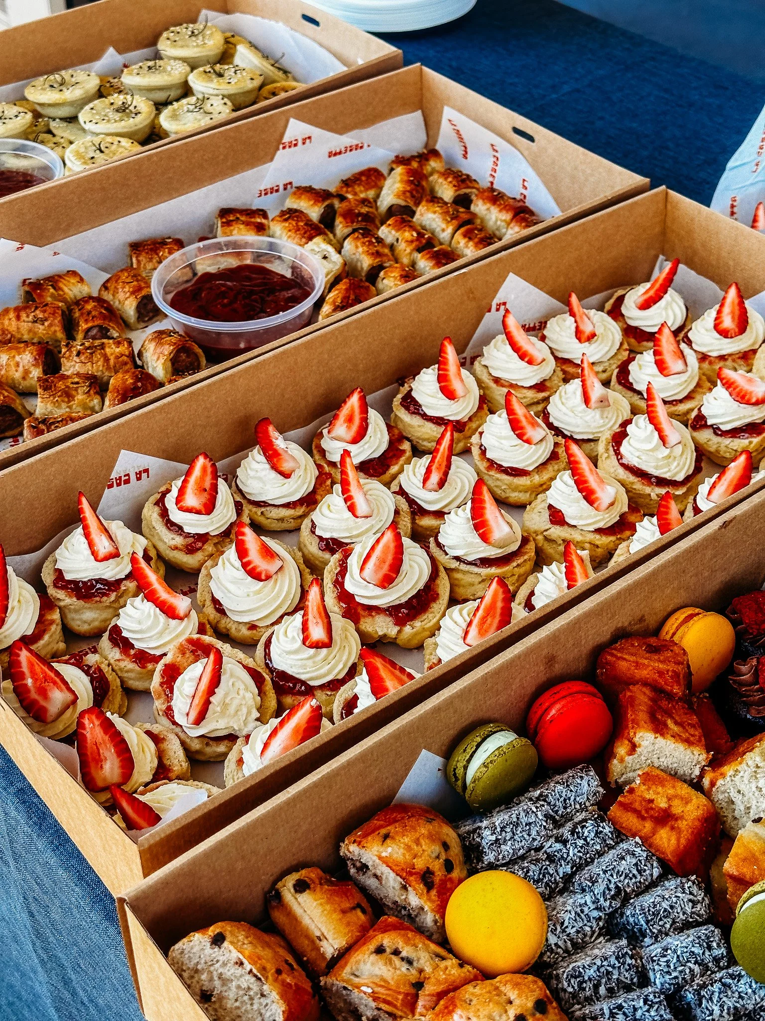 Morning tea catering boxes prepared for corporate event in Logan