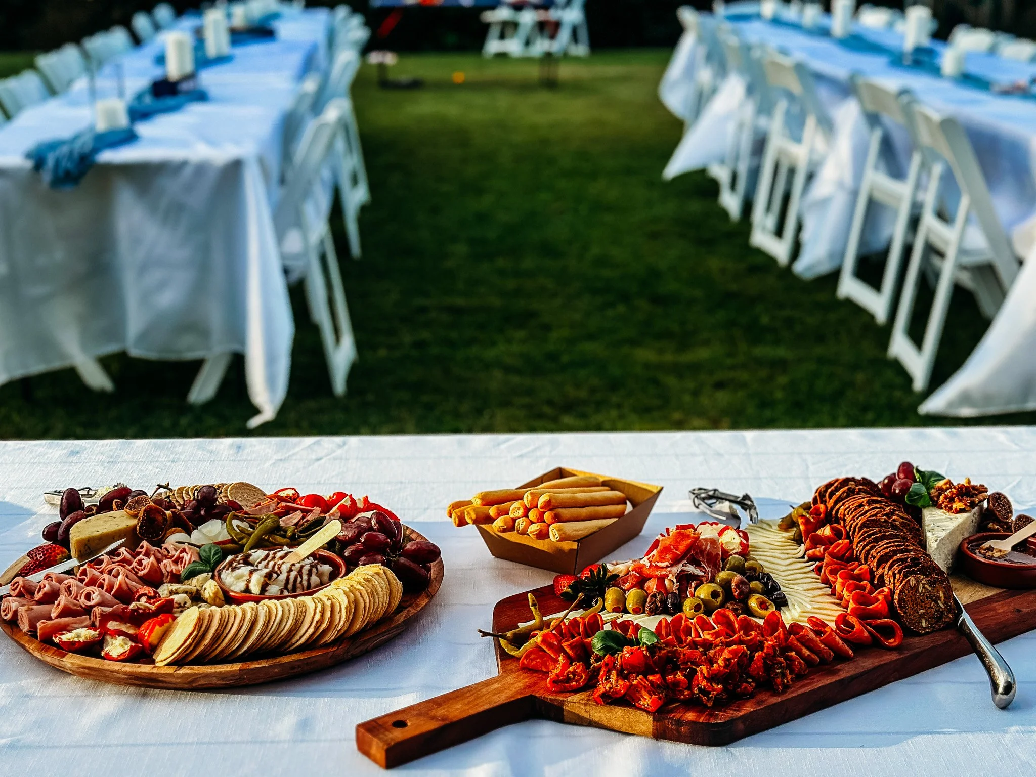 Grazing boards at an outdoor event catered by Logan Catering Co