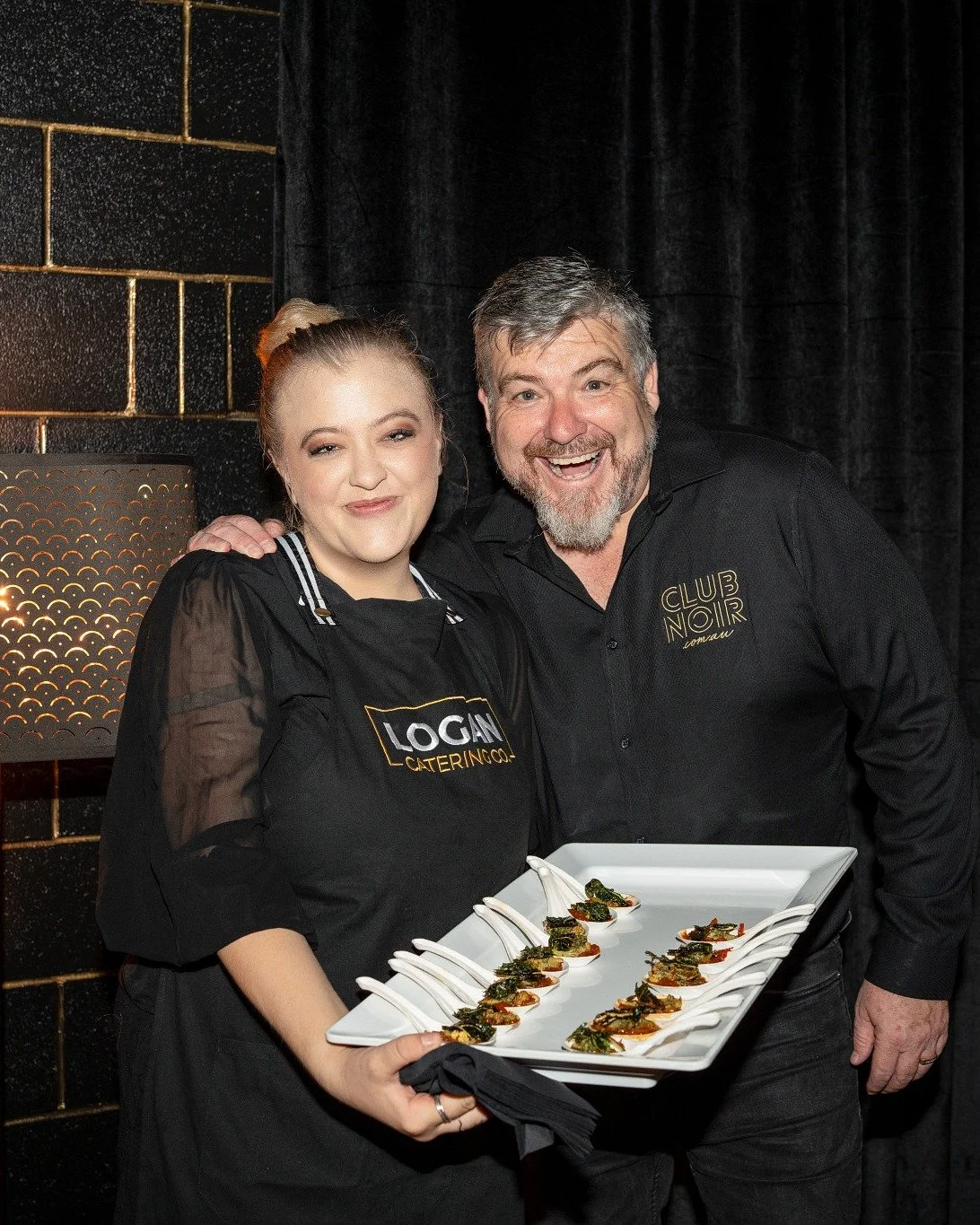 Logan Catering Co team serving canapés at corporate networking event