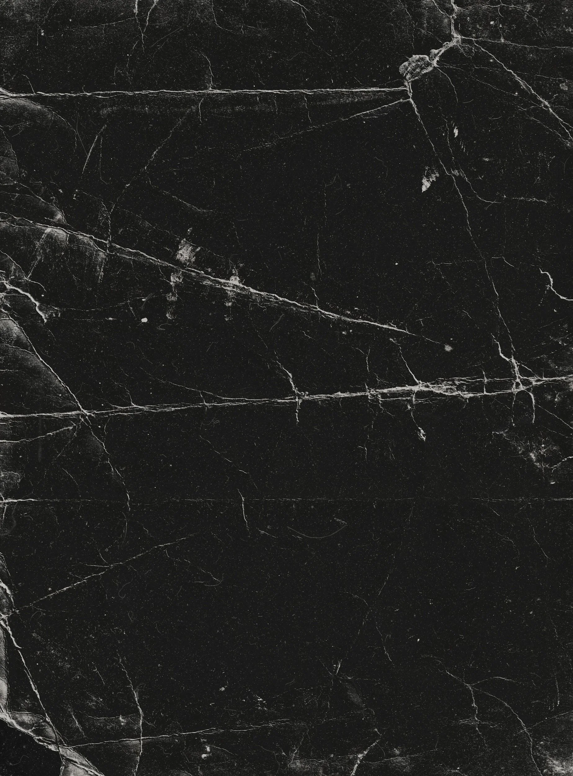 Close-up of black marble surface with white veining.