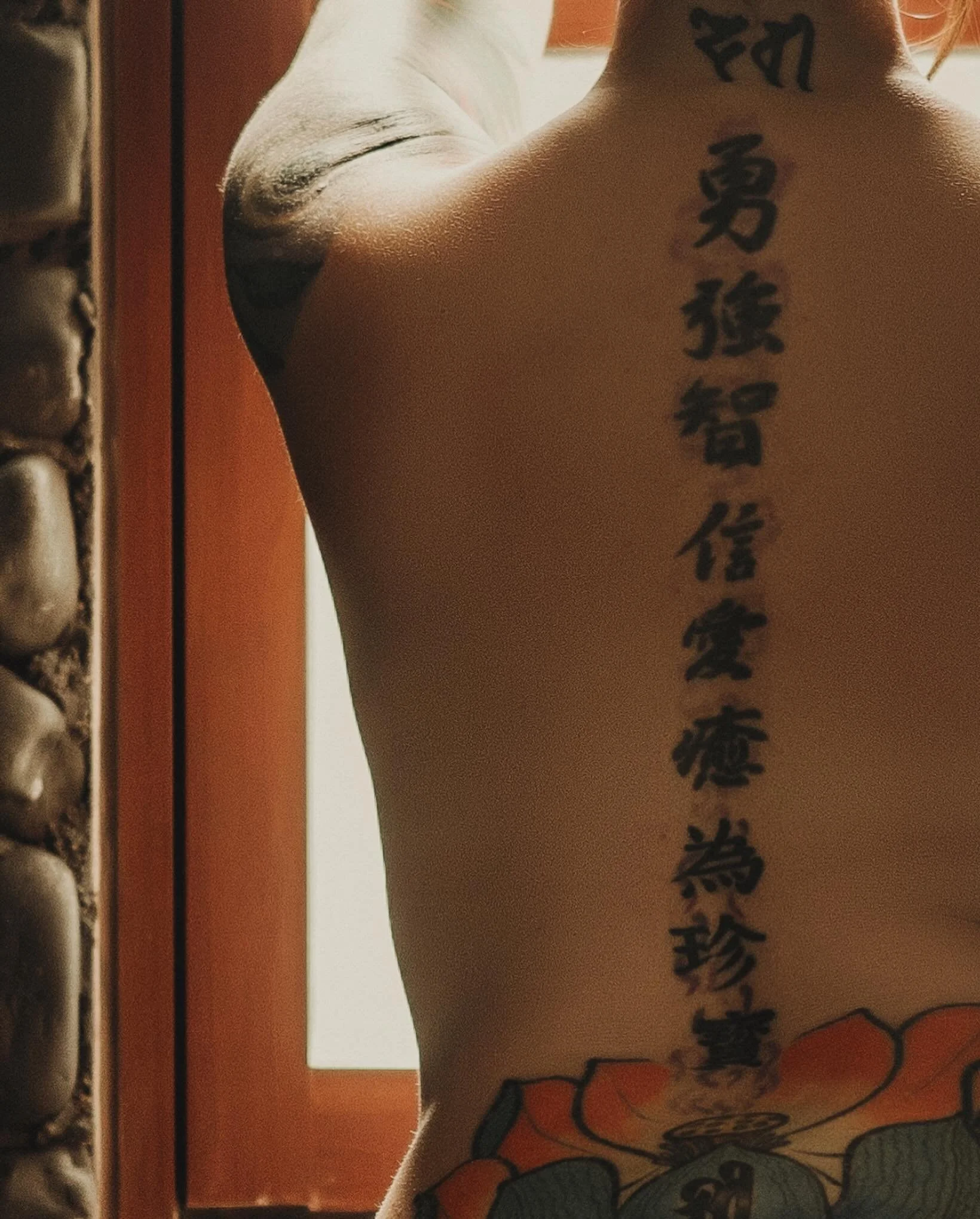 Im often asked what the tattoo on my back says / signifies. At the nape is Sanskrit Devī, the Goddess, followed by kanji representing courage, strength, wisdom, faith, love, and healing continuing into the idea of the precious jewel or treasure, eman
