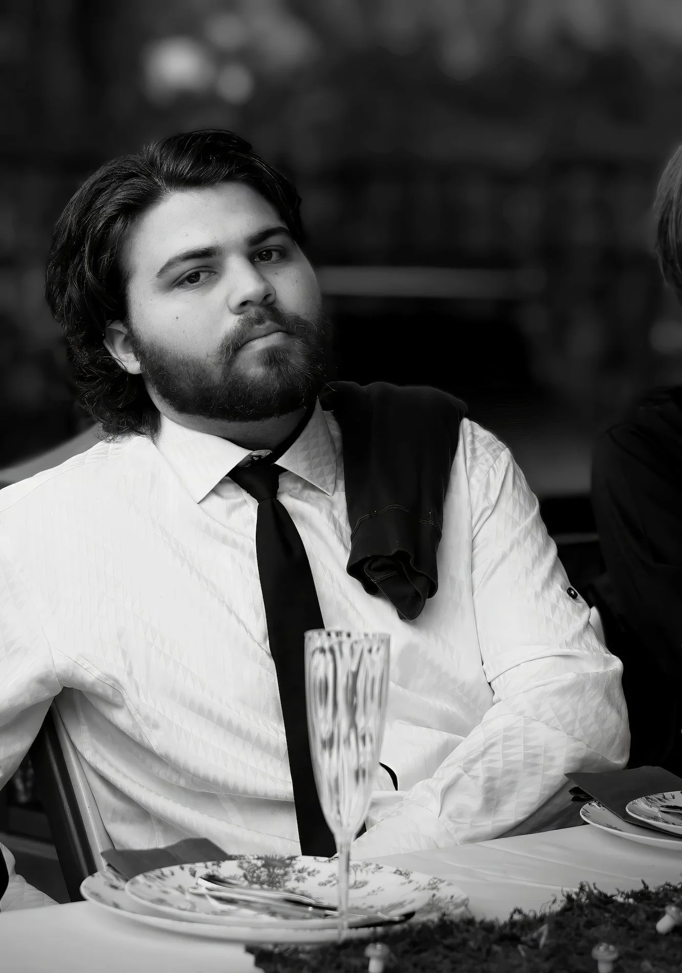 Handsome young man with a beard enjoying a dinner event in Pace FL