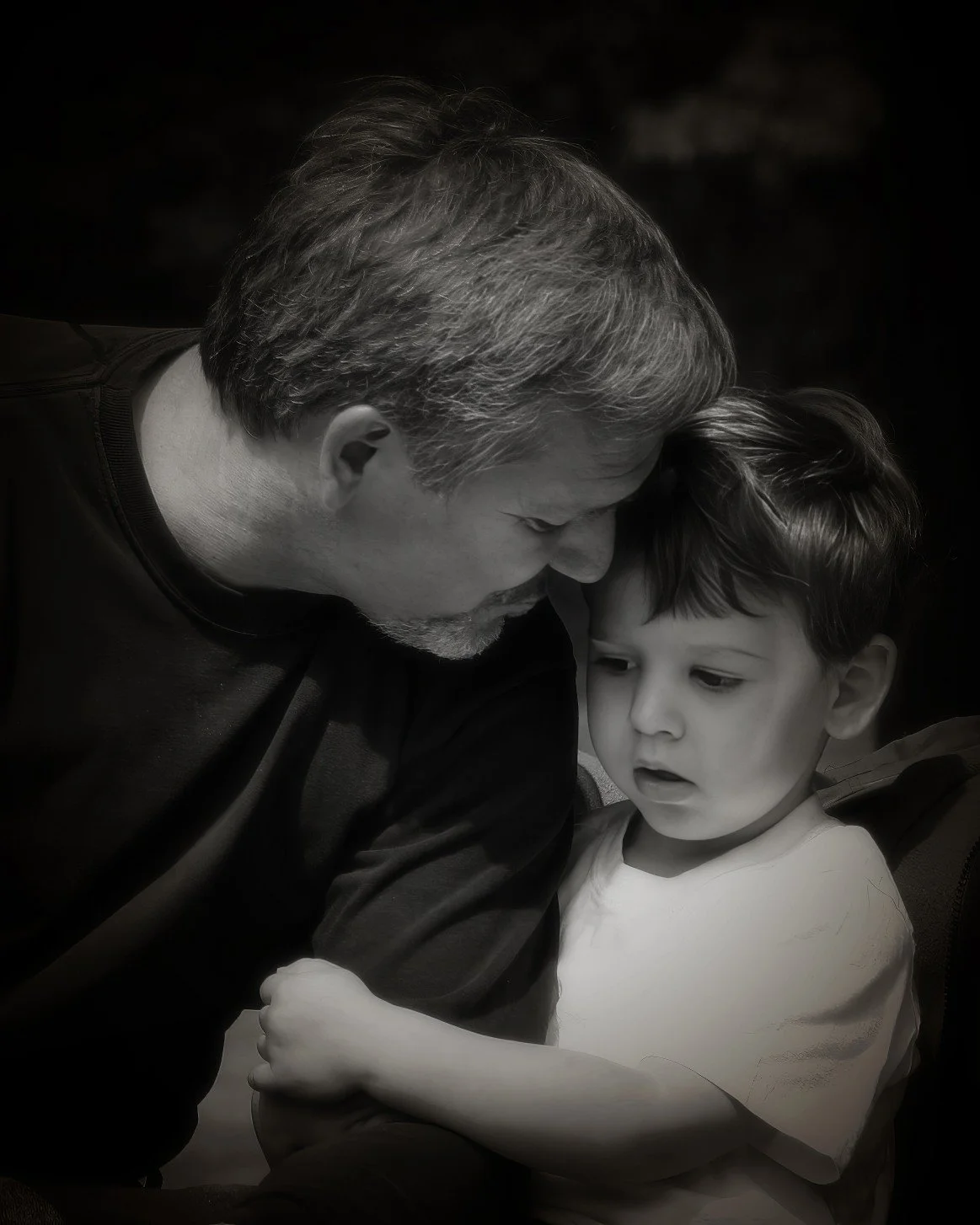 Pensacola family portrait candid moment between father and son