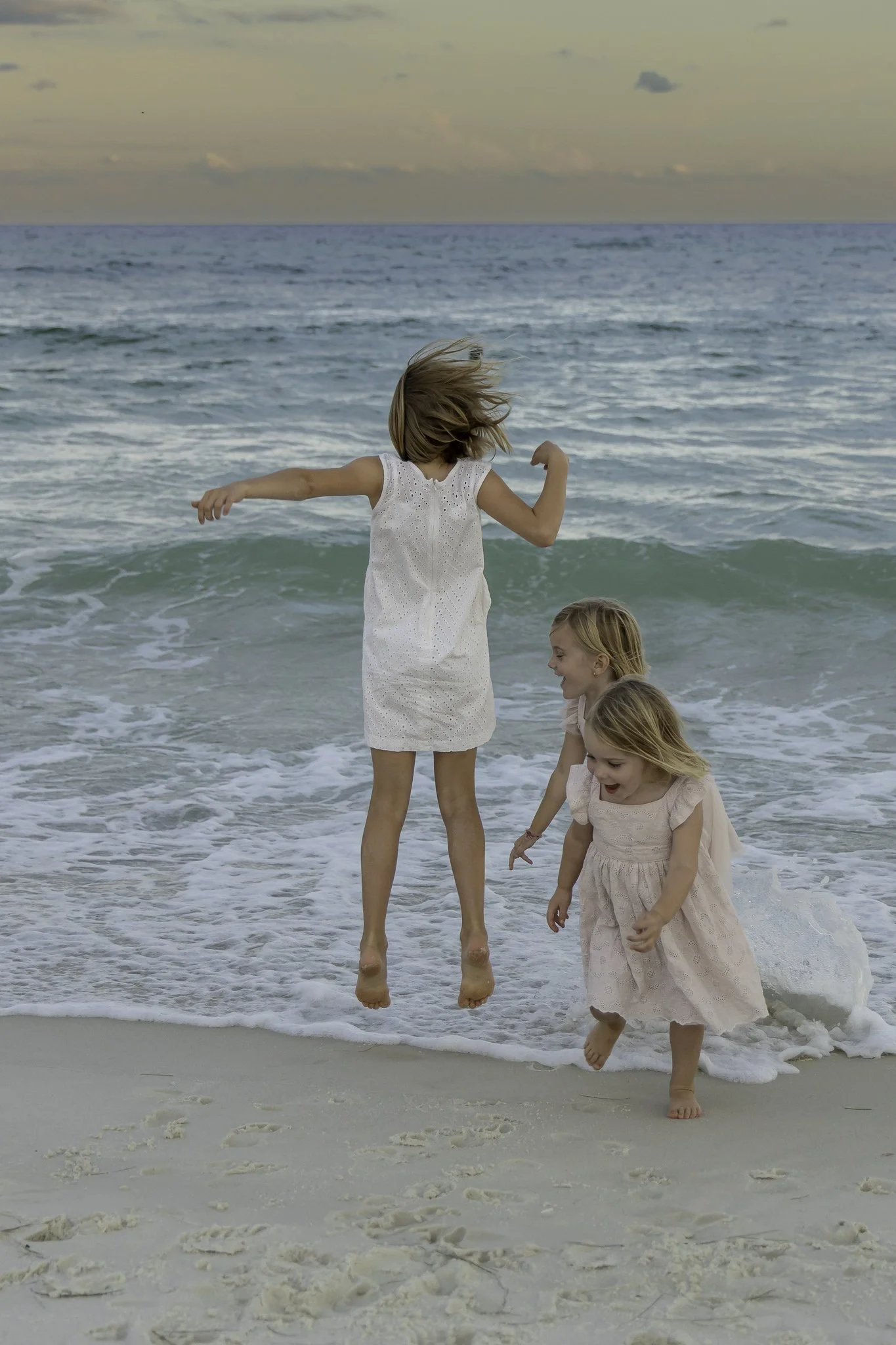 3 sisters having fun in the surf Pensacola Beach Golden Hour