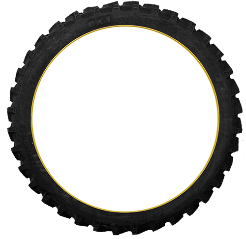 Close-up of a black rubber tire with a yellow outline on the inner edge, isolated on a black background.
