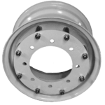 Close-up of a circular metal object with evenly spaced bolt holes around the edge and a large oval opening in the center